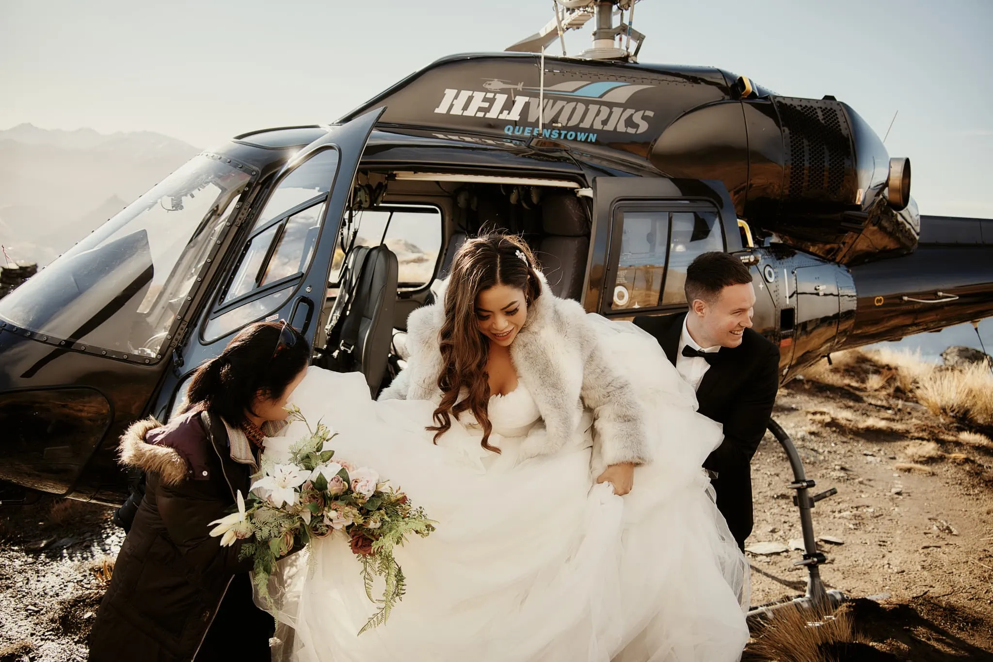 Queenstown New Zealand Elopement Wedding Photographer - Amy and Callum enjoy their Queenstown Heli Pre Wedding Shoot by arriving in a helicopter.