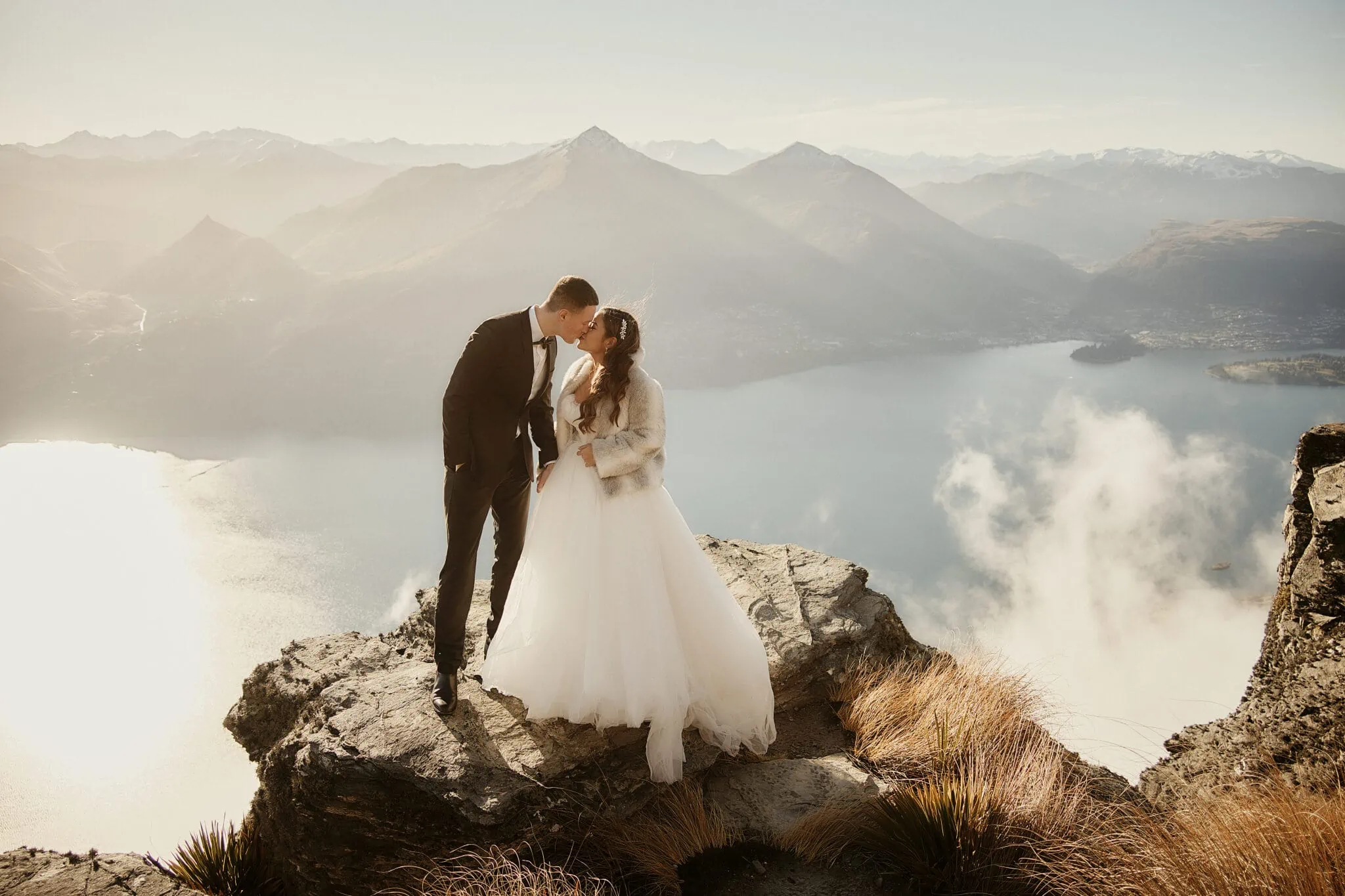 Queenstown New Zealand Elopement Wedding Photographer - Amy and Callum having a Queenstown Heli Pre Wedding Shoot on top of a mountain overlooking Lake Wanaka.