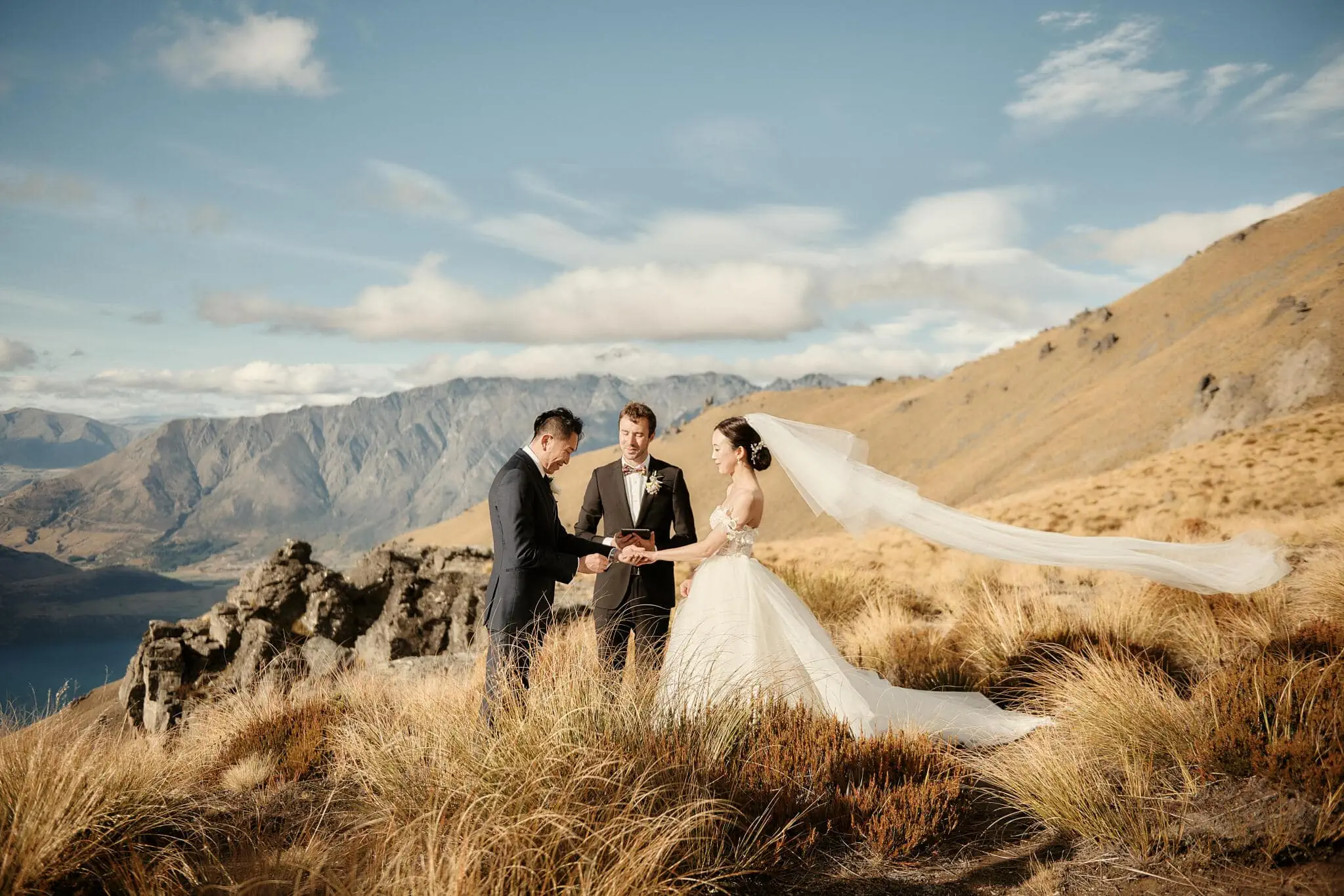 Queenstown New Zealand Elopement Wedding Photographer - Sarah and Tim's scenic Queenstown heli elopement wedding on top of a mountain in New Zealand.