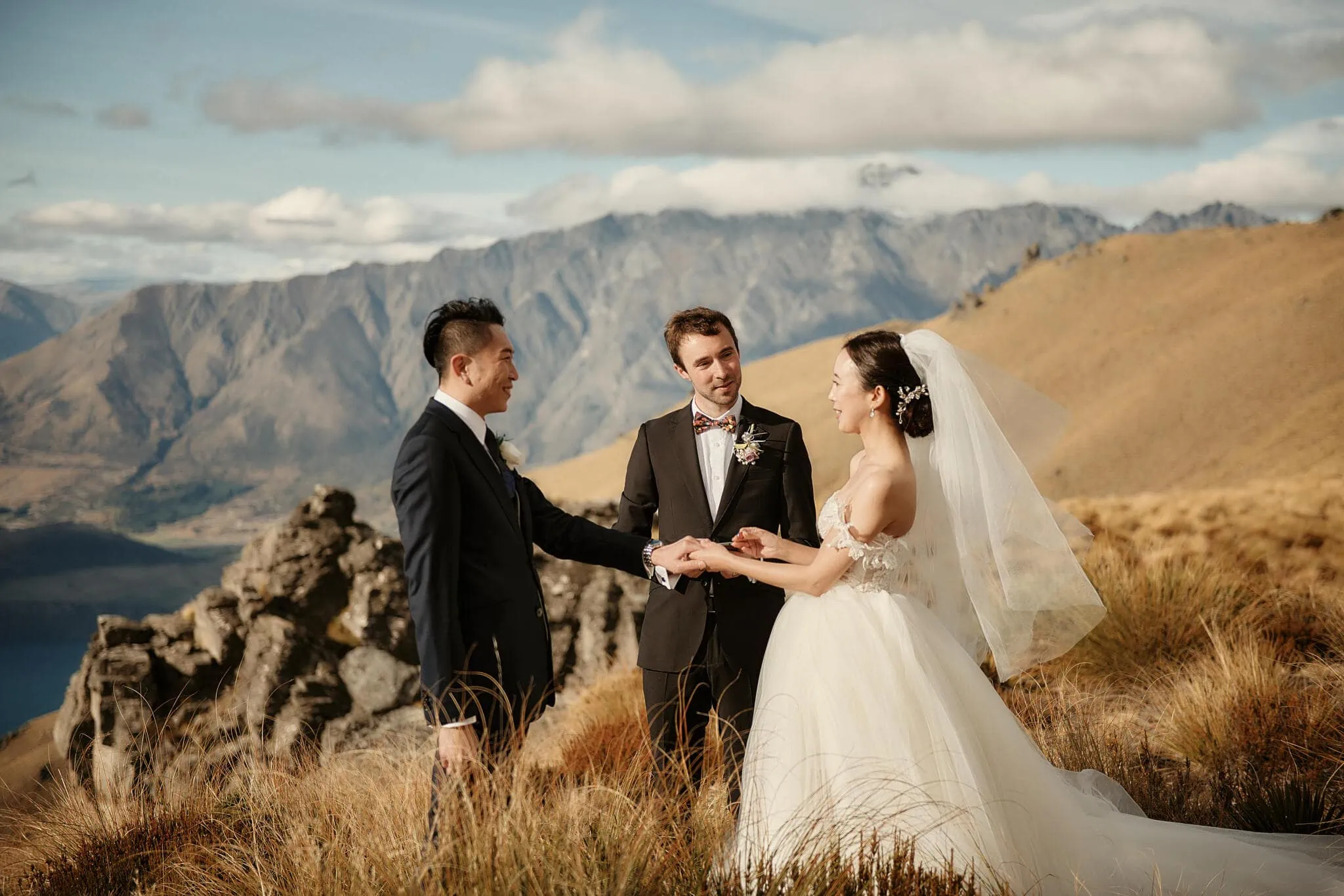 Queenstown New Zealand Elopement Wedding Photographer - Sarah and Tim have a scenic Queenstown heli elopement wedding on top of a mountain in New Zealand.