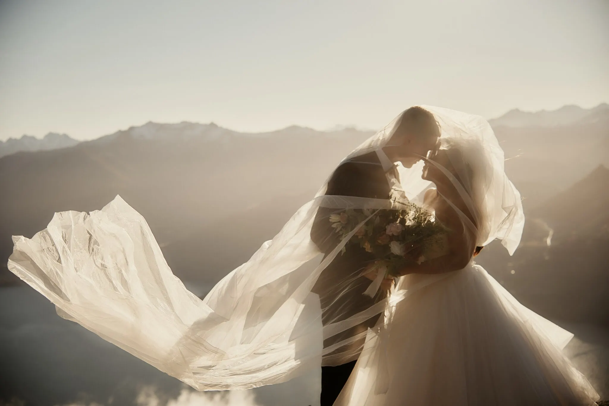 Queenstown New Zealand Elopement Wedding Photographer - Amy and Callum sharing a romantic kiss during their Queenstown mountain pre-wedding shoot.