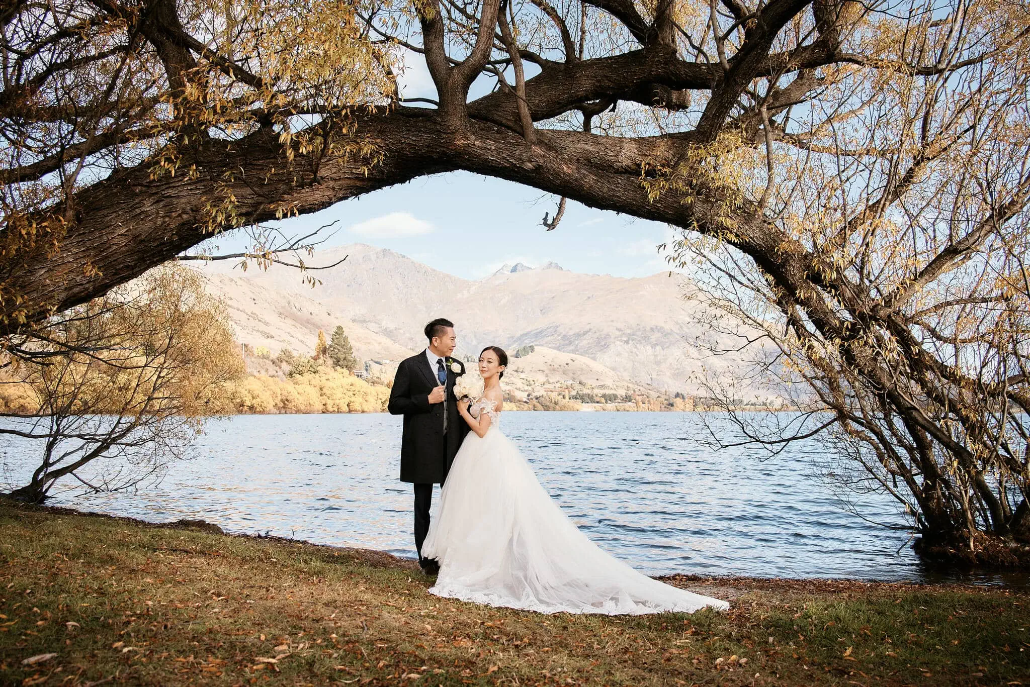 Queenstown New Zealand Elopement Wedding Photographer - Sarah and Tim's scenic Queenstown heli elopement wedding under a tree near Lake Wanaka.