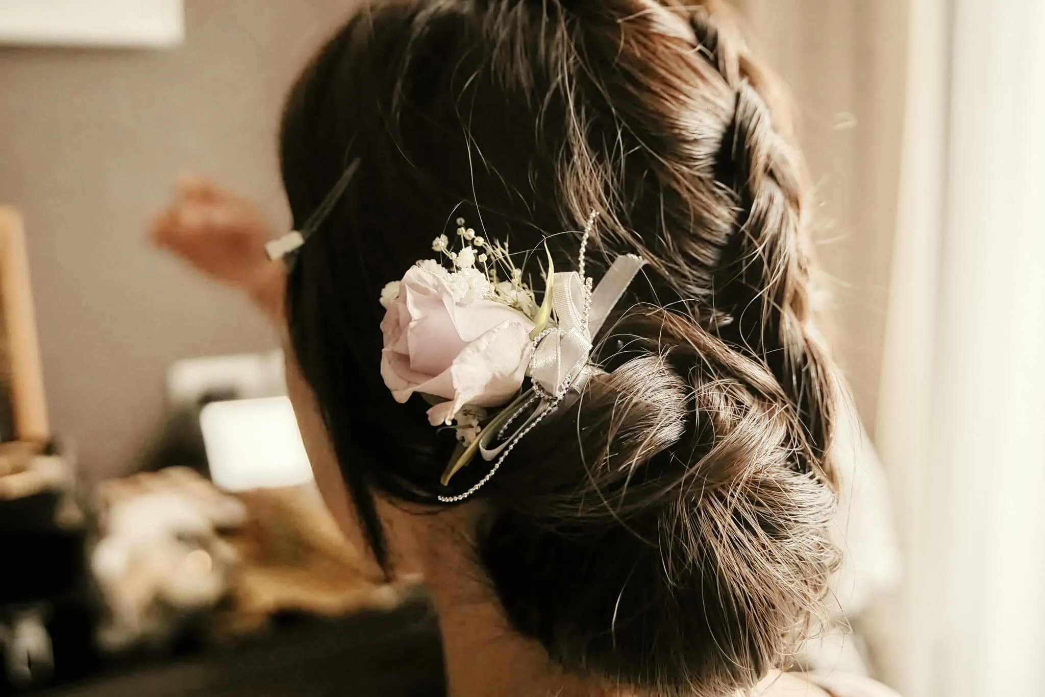 Queenstown New Zealand Elopement Wedding Photographer - A scenic Queenstown heli elopement wedding with a bride wearing a flower in her hair.