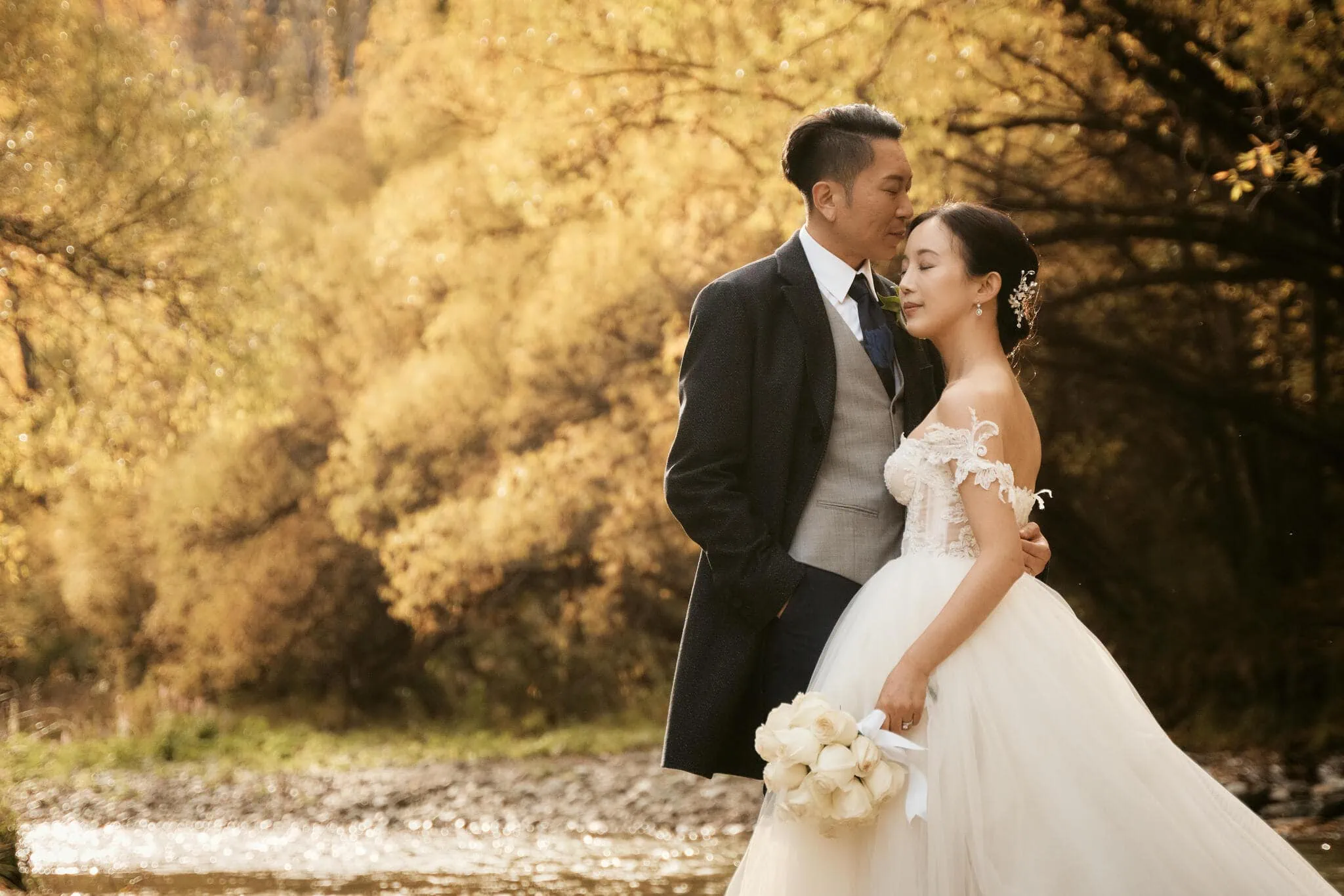 Queenstown New Zealand Elopement Wedding Photographer - Sarah and Tim's scenic elopement wedding by a river in autumn in Queenstown.