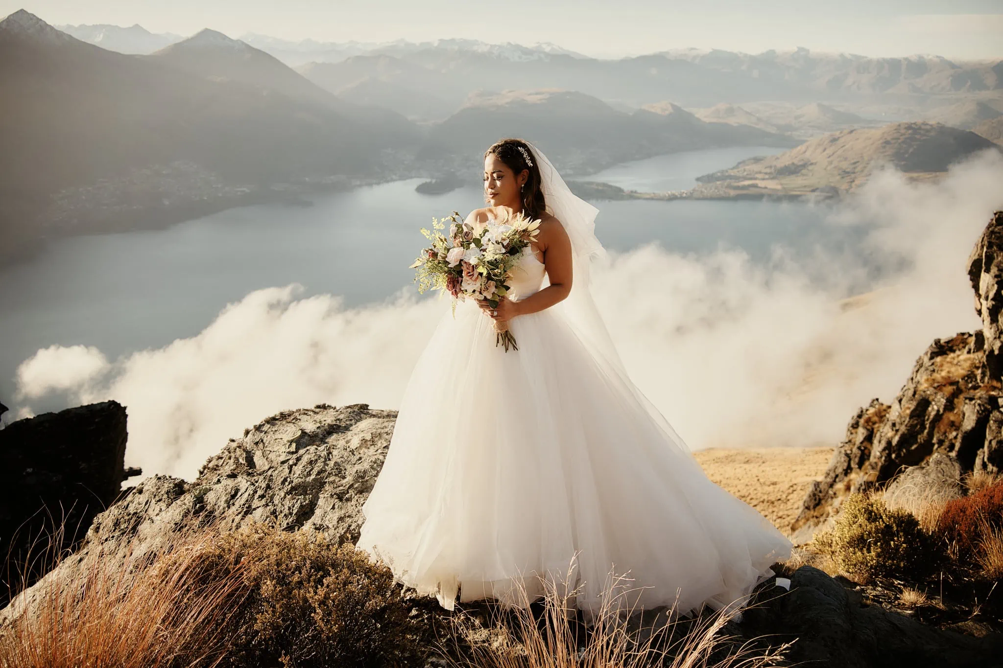Queenstown New Zealand Elopement Wedding Photographer - Amy and Callum have a Queenstown Heli Pre Wedding Shoot on top of a mountain overlooking Lake Wanaka.