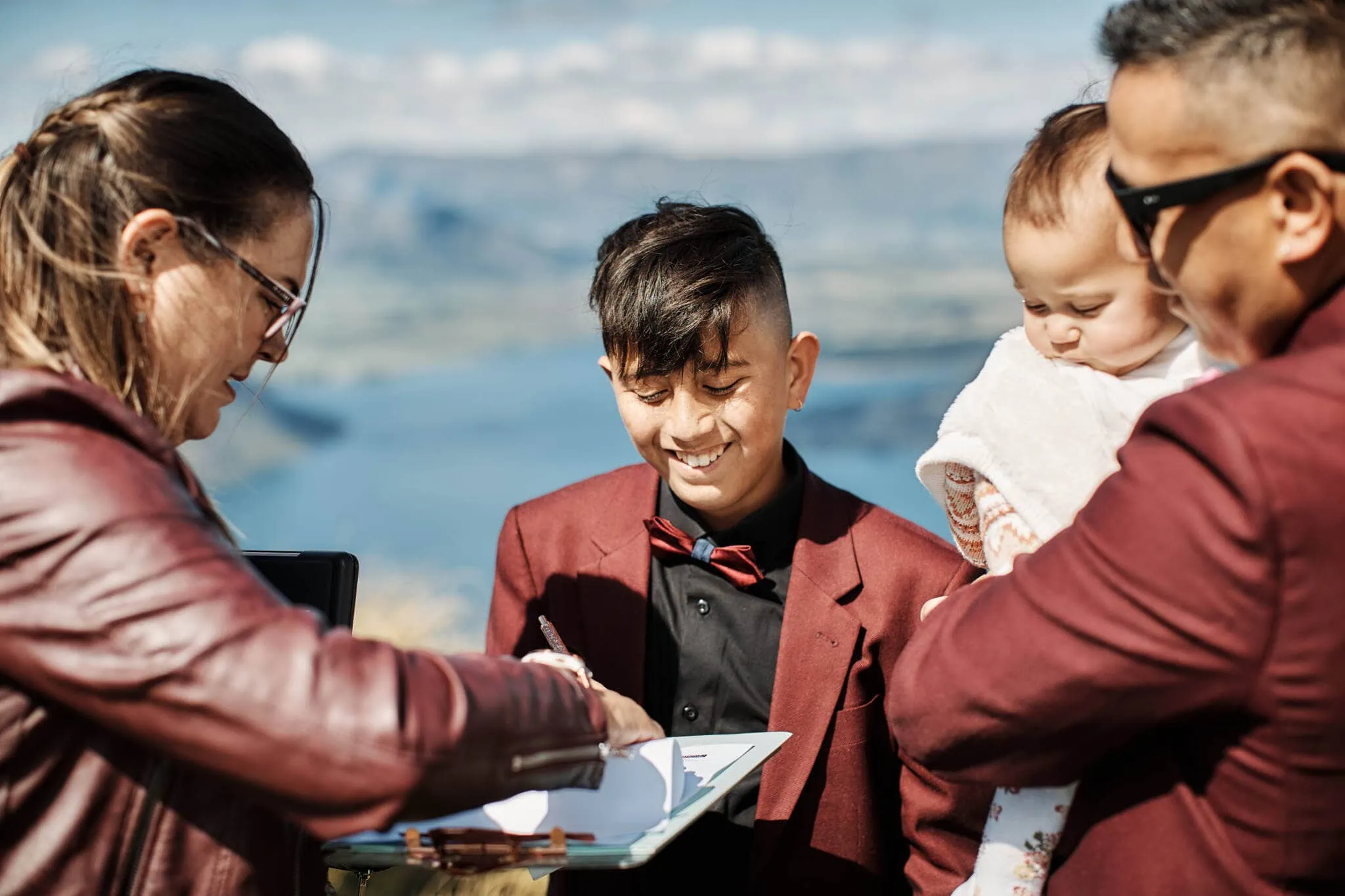 Queenstown New Zealand Elopement Wedding Photographer - Nikita and Terrence's Coromandel Peak Heli Elopement Wedding includes a bride, groom, and baby.