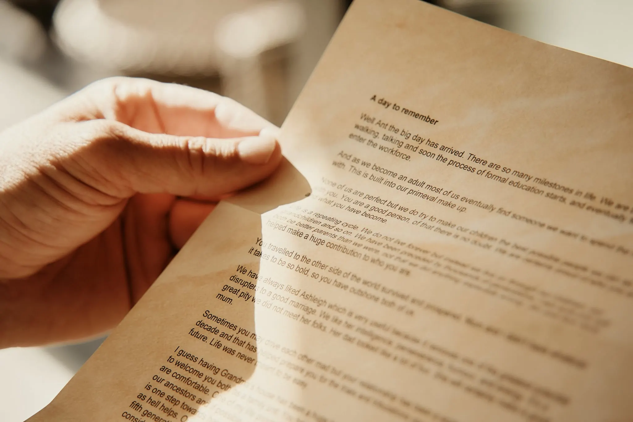 Queenstown New Zealand Elopement Wedding Photographer - A hand holding a piece of paper at Ashleigh and Anthony's Roy's Peak Heli Elopement Wedding.