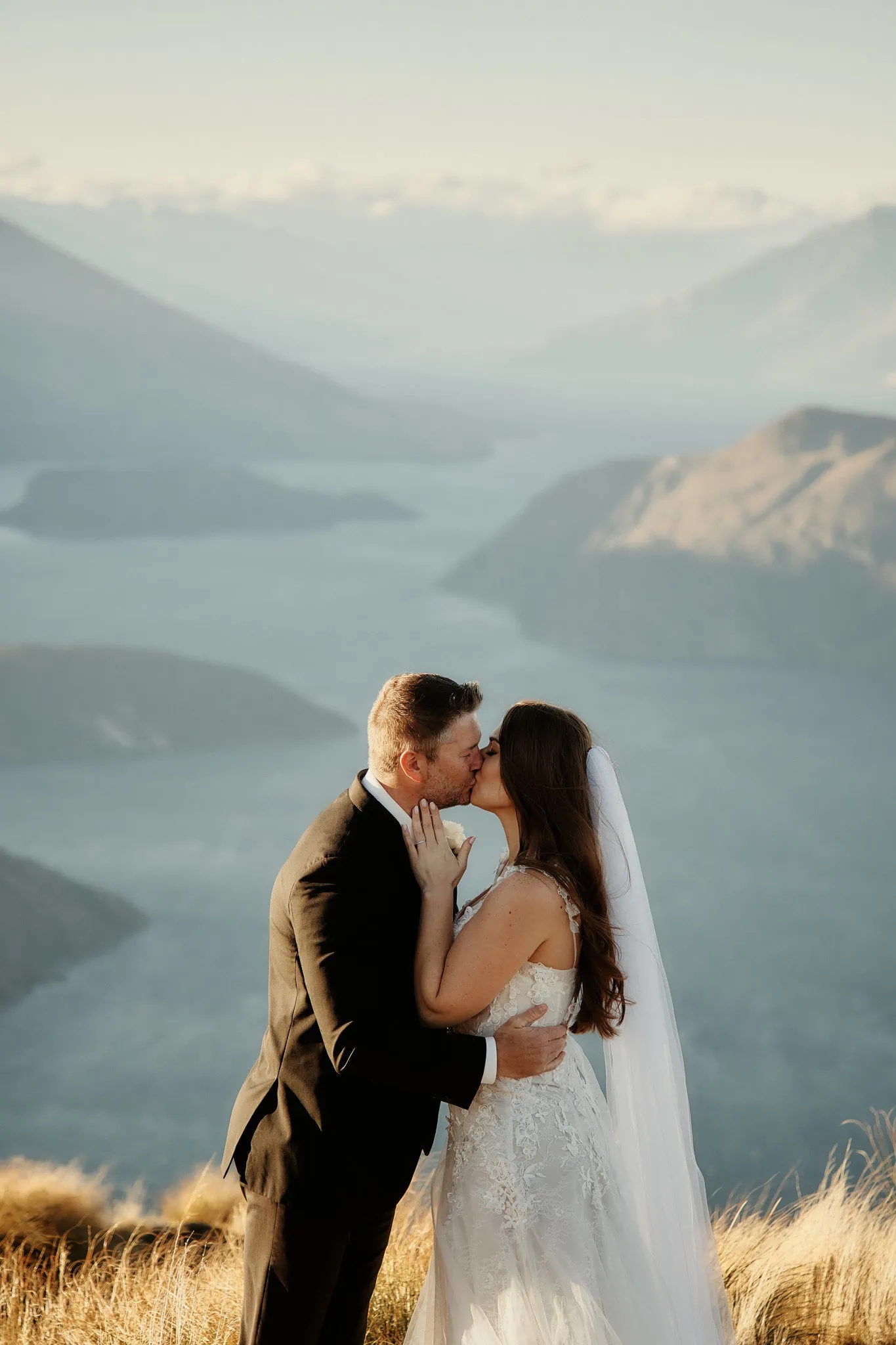 Queenstown New Zealand Elopement Wedding Photographer - Ashleigh and Anthony's wedding at Roy's Peak, where they kissed on top of a hill overlooking Lake Wanaka.