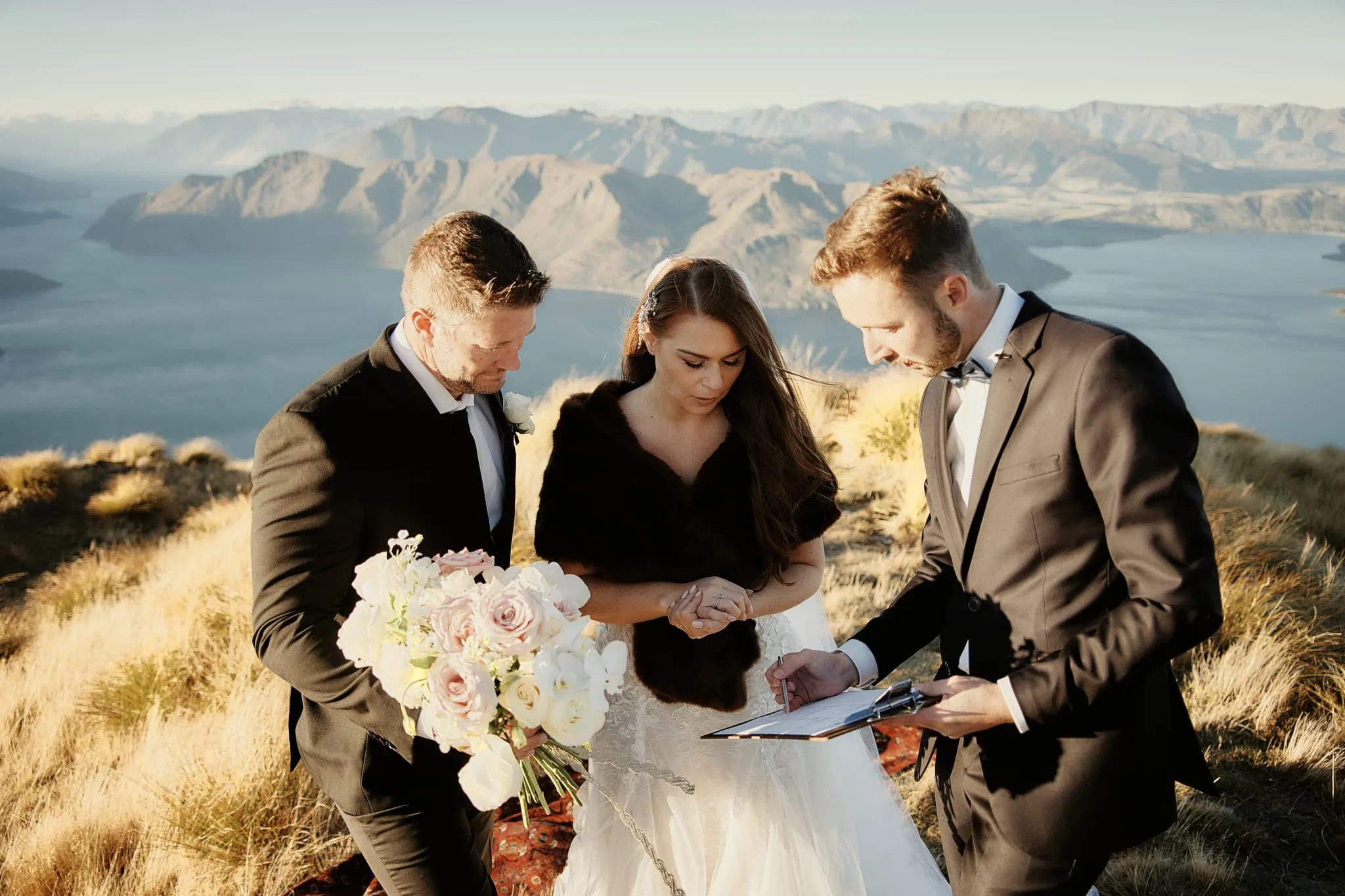 Queenstown New Zealand Elopement Wedding Photographer - Ashleigh and Anthony celebrate their wedding vows with a breathtaking Roy's Peak Heli Elopement on a New Zealand mountain.