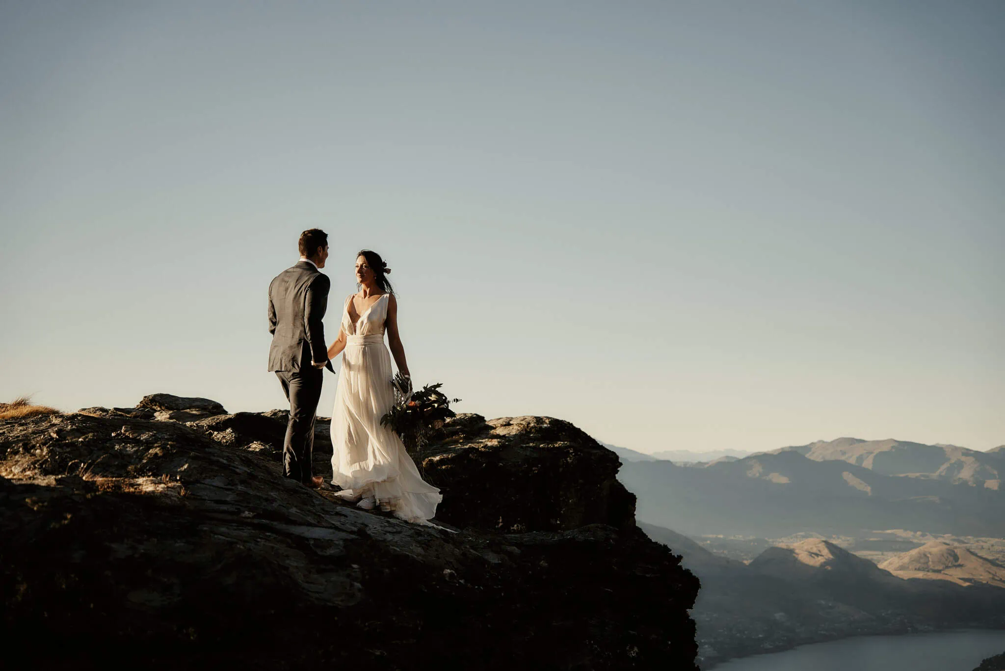 Queenstown New Zealand Elopement Wedding Photographer - Sarah and Bobby's Queenstown Heli Elopement Wedding, with a stunning view of Lake Wanaka from the mountain top.