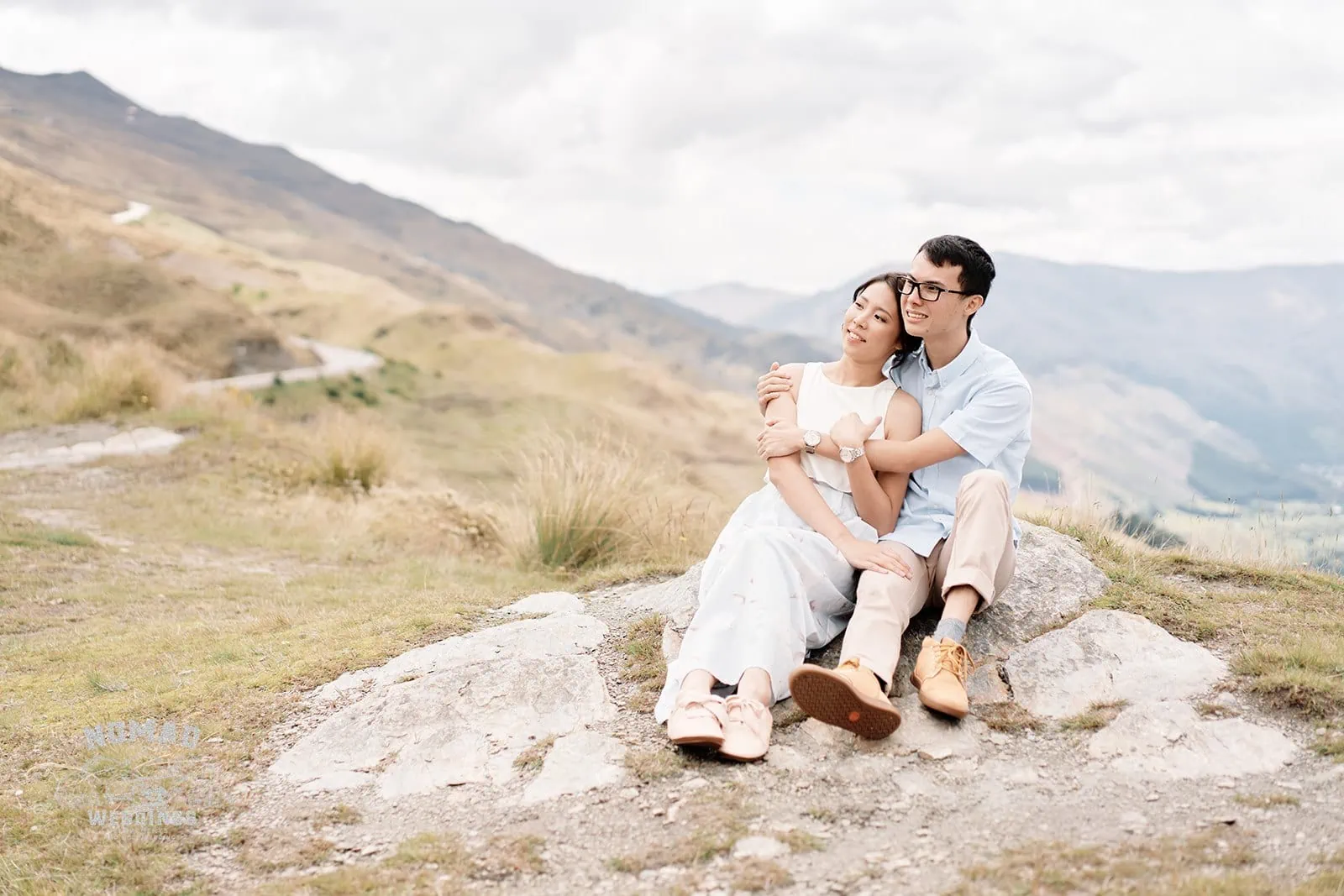 Queenstown New Zealand Elopement Wedding Photographer - Keywords: COUPLE, MOUNTAINS

Updated description: A couple enjoying the mountain views while seated on top of a rock.