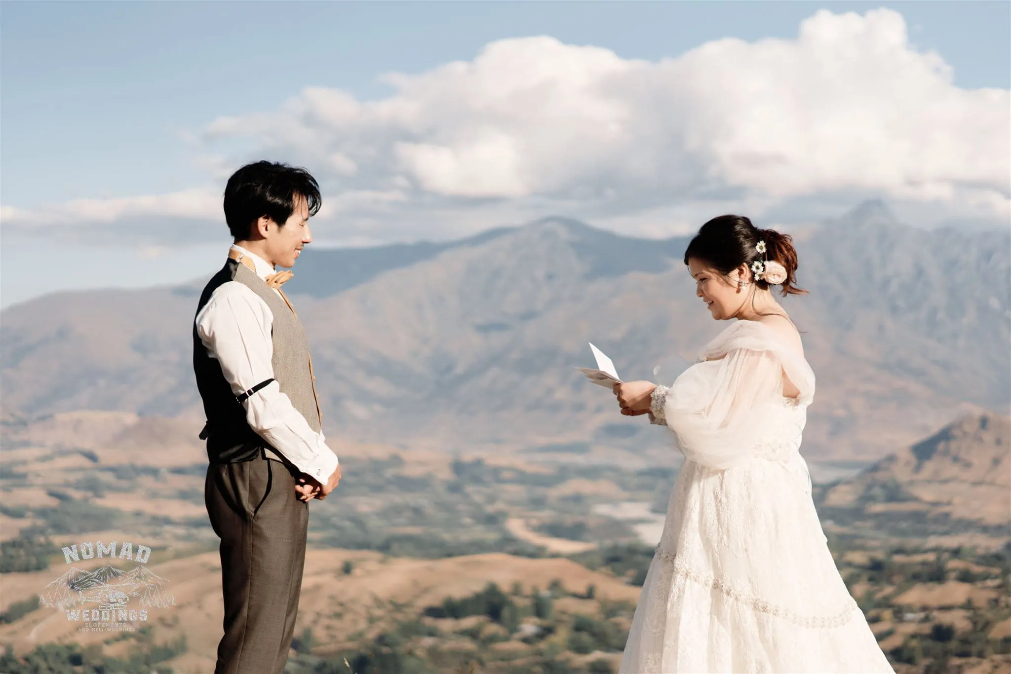 Queenstown New Zealand Elopement Wedding Photographer - A bride and groom on a mountain in Queenstown.