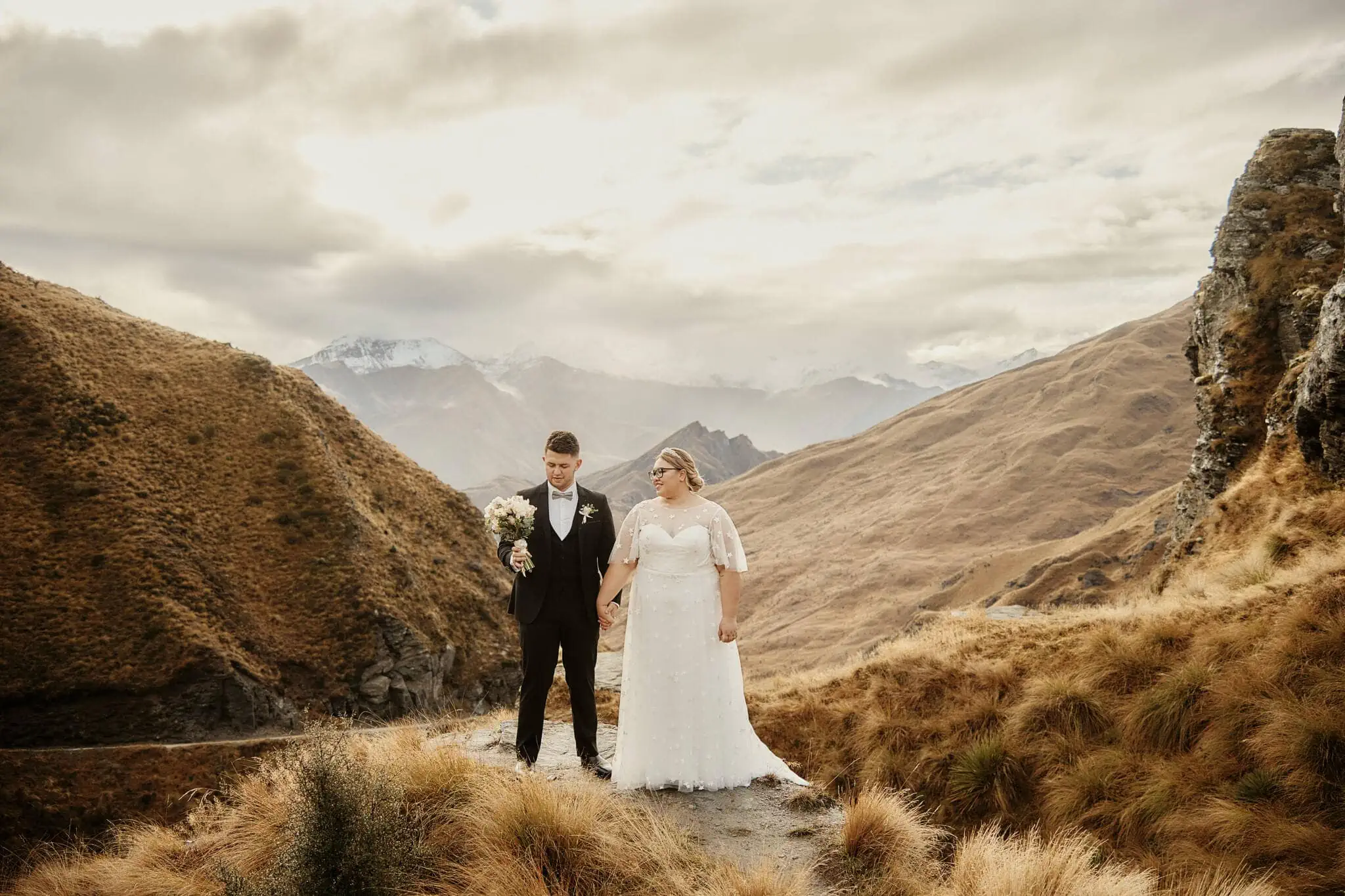 Queenstown New Zealand Elopement Wedding Photographer - Caitiann and Kiyo celebrate their Coronet Peak elopement wedding on a path in the mountains.