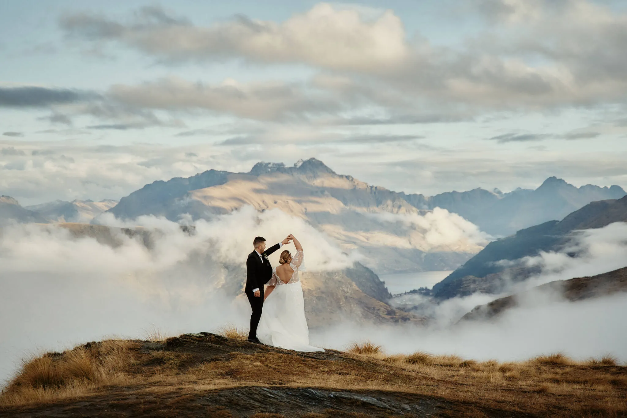 Queenstown New Zealand Elopement Wedding Photographer - Caitiann and Kiyo's elopement wedding at Coronet Peak with a breathtaking mountaintop view.