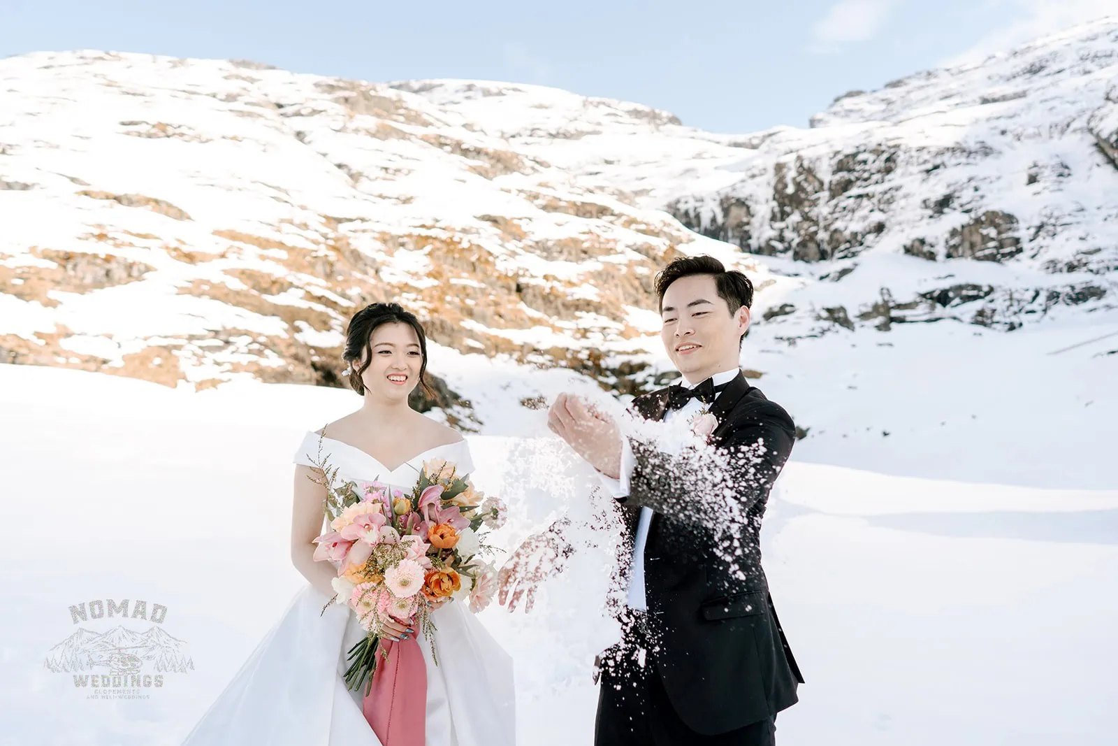 Queenstown New Zealand Elopement Wedding Photographer - Bo and Junyi having a playful snow fight during their Heli Pre Wedding Shoot.