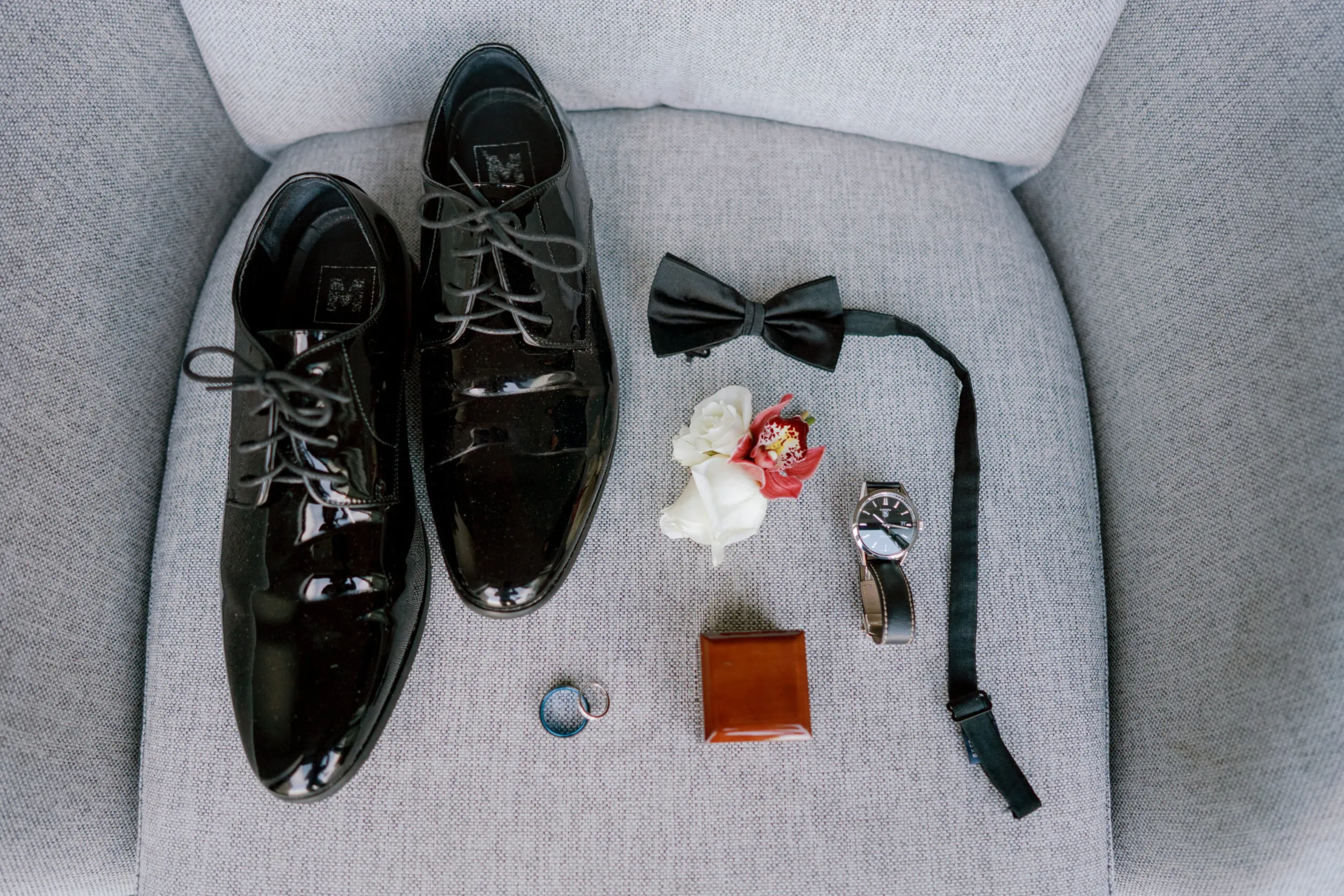 Queenstown New Zealand Elopement Wedding Photographer - Groom's shoes and accessories on a chair at Lam and Wendy's Kamana Lakehouse Wedding.