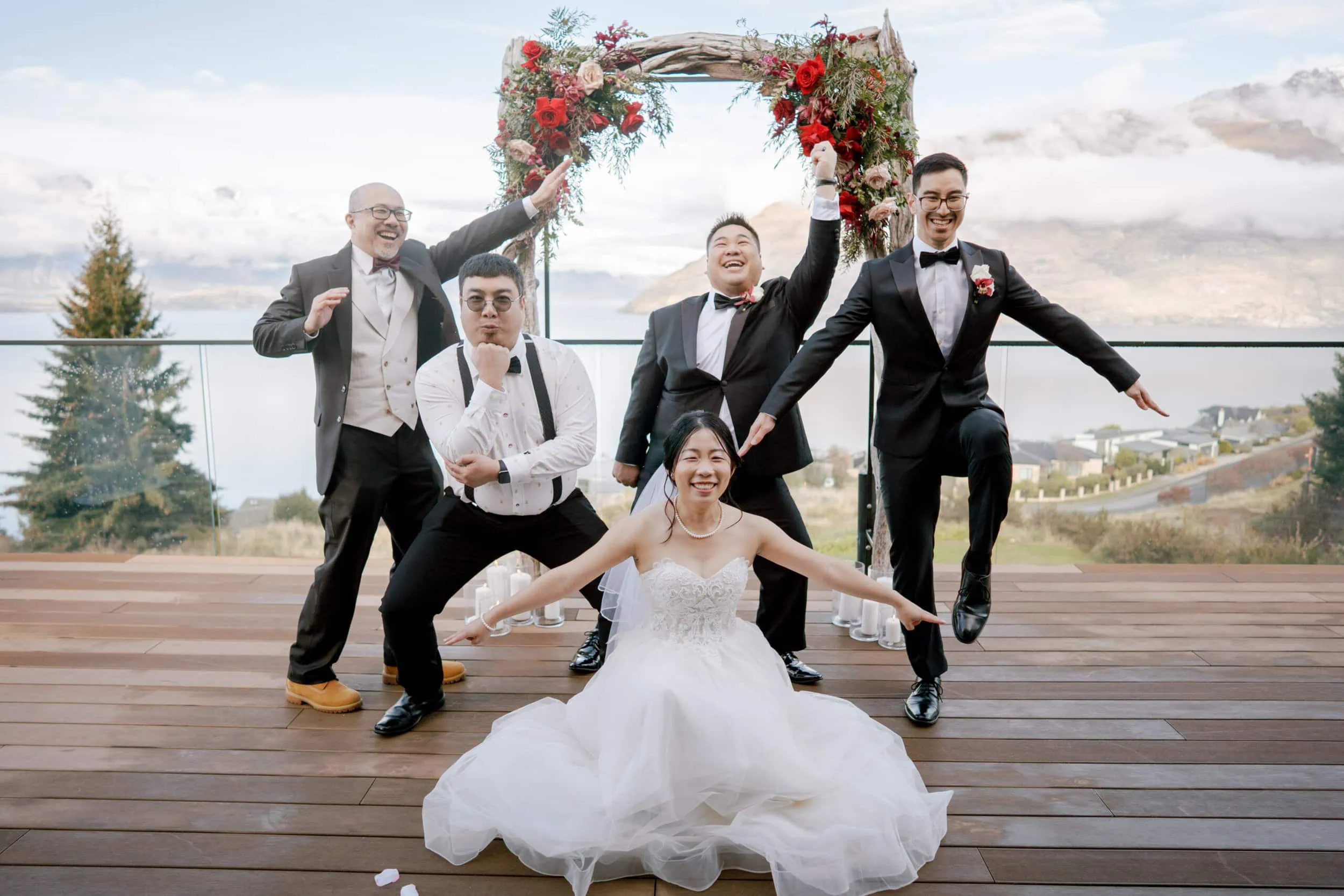 Queenstown New Zealand Elopement Wedding Photographer - A group of bridesmaids and groomsmen pose for a wedding photo at Lam and Wendy's Kamana Lakehouse Wedding.