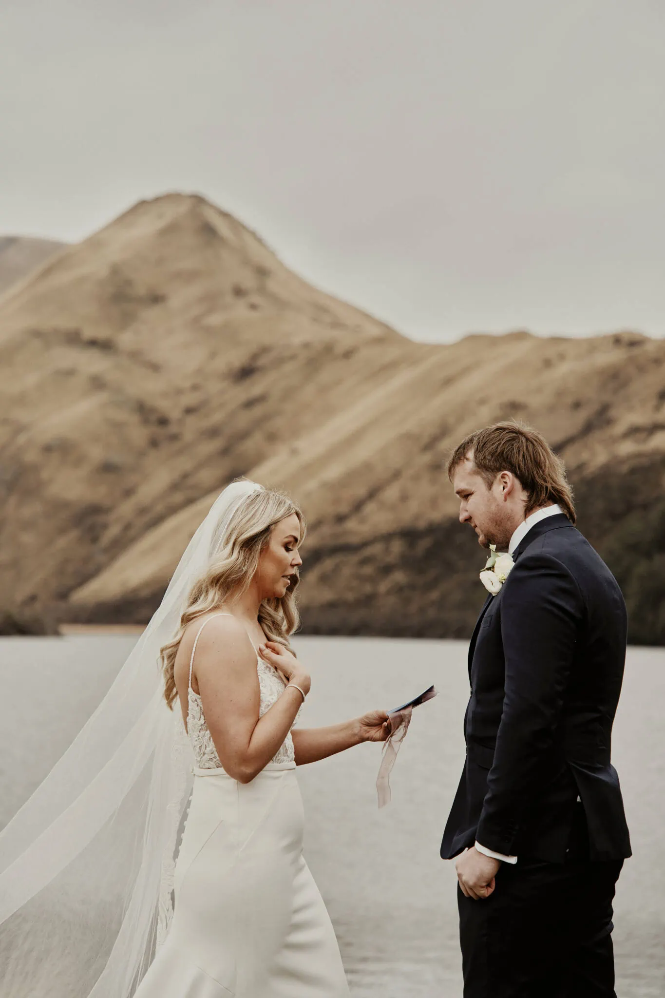 Queenstown New Zealand Elopement Wedding Photographer - Rebecca and Dylan exchange vows at an enchanting lake for their Moke Lake elopement wedding.