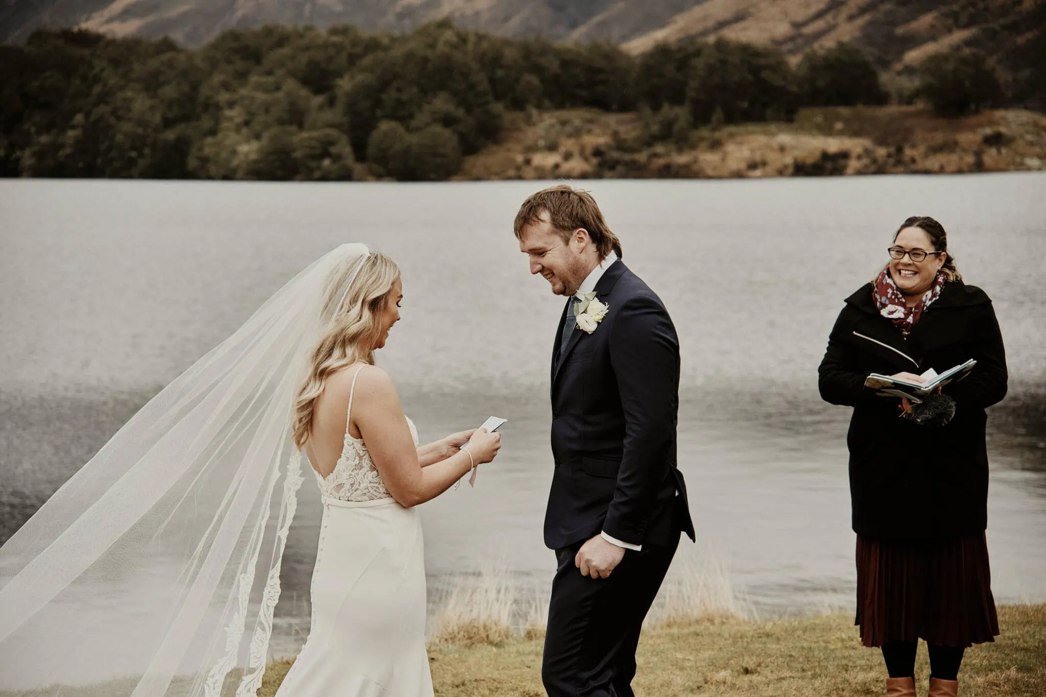 Queenstown New Zealand Elopement Wedding Photographer - Rebecca and Dylan exchange their vows in front of an enchanting lake.