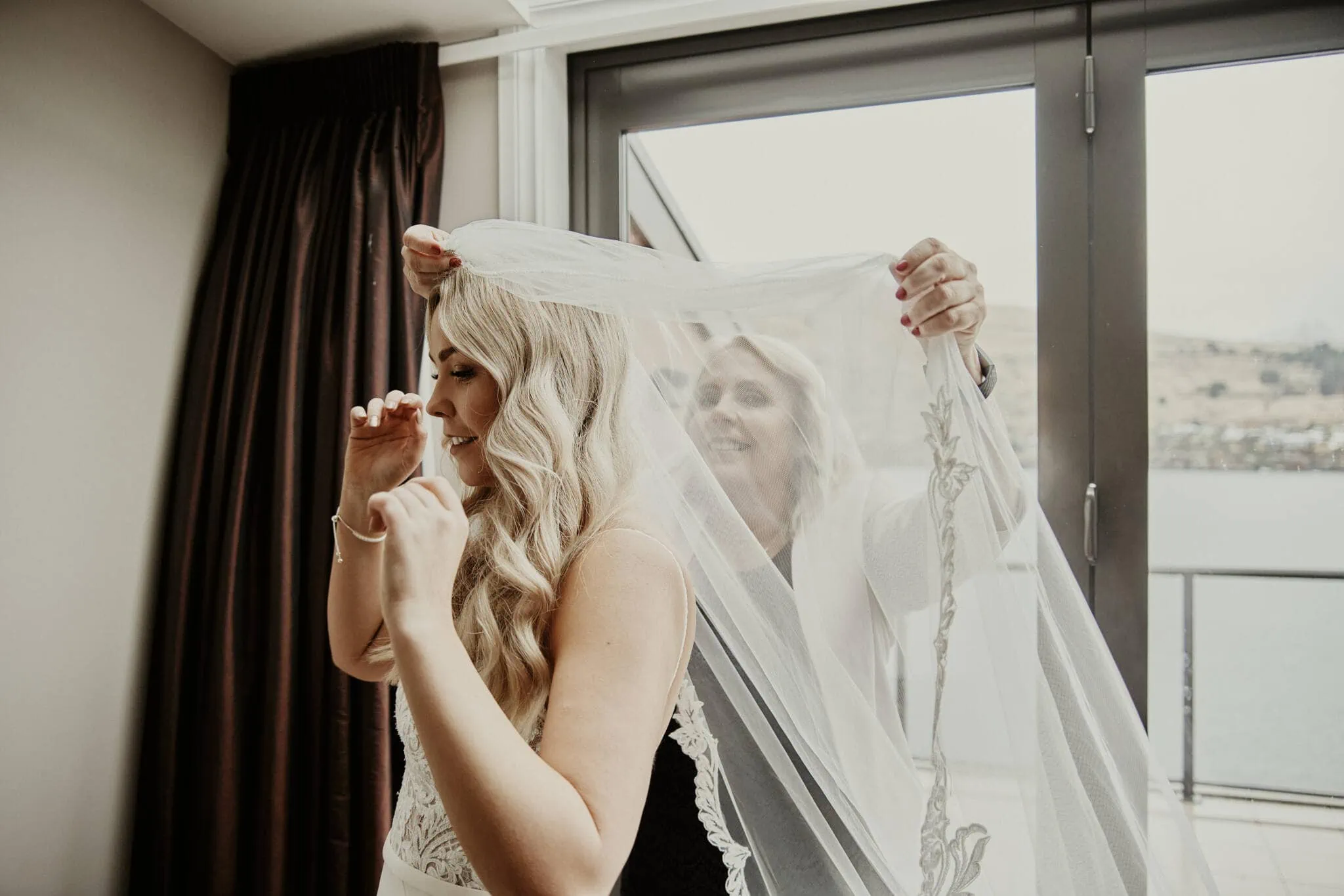 Queenstown New Zealand Elopement Wedding Photographer - Rebecca wearing a veil during an enchanting Moke Lake elopement wedding.
