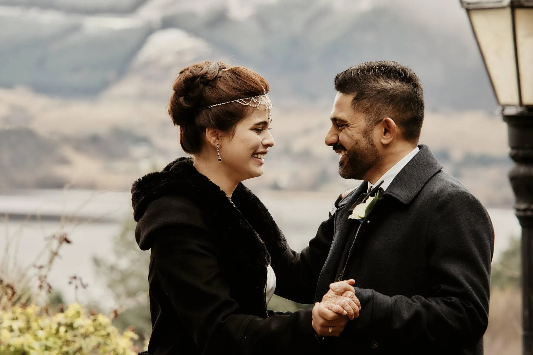 Queenstown New Zealand Elopement Wedding Photographer - Wasim and Yumn in a Queenstown Islamic Wedding, standing in front of a lamp post.
