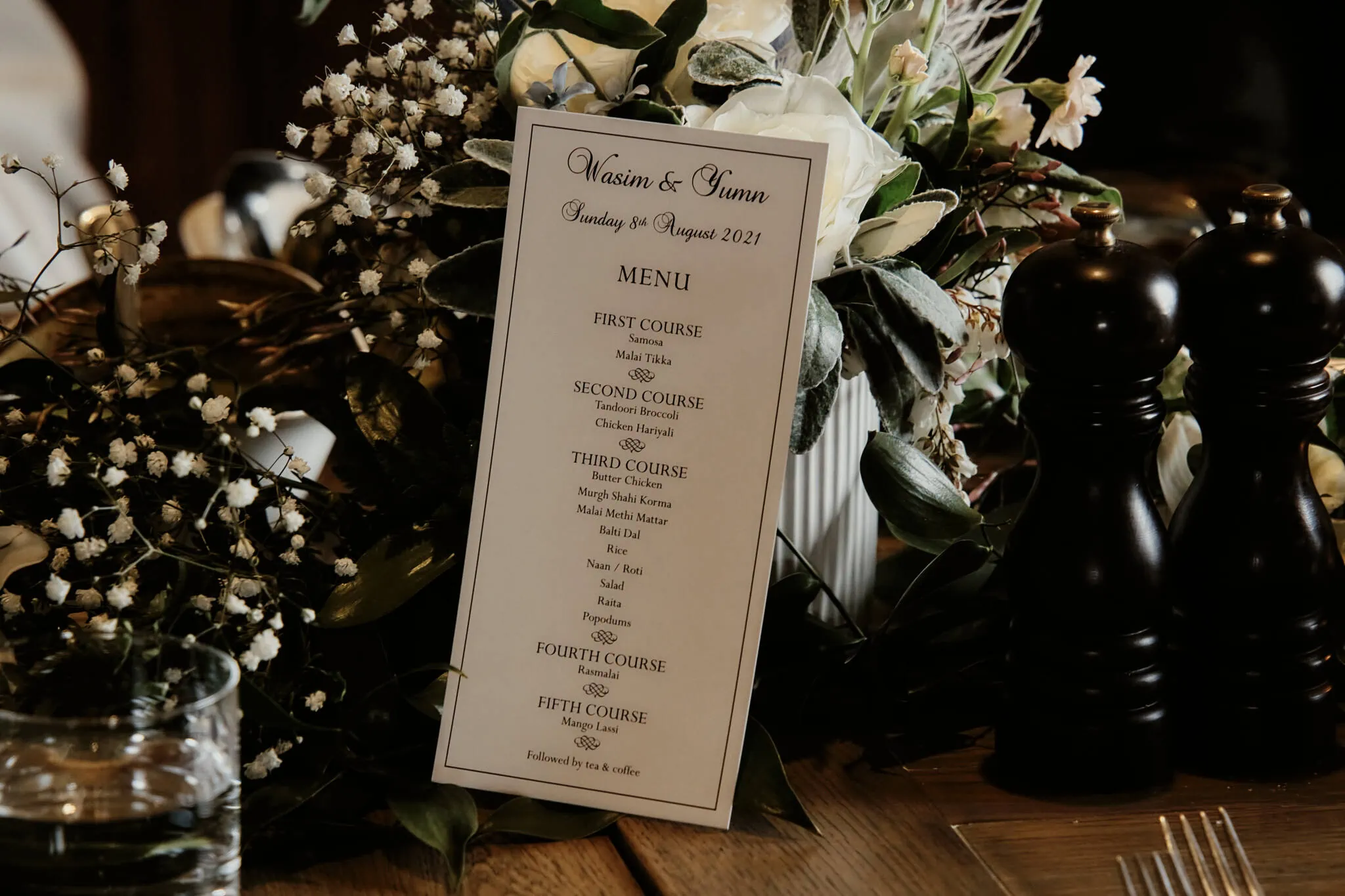Queenstown New Zealand Elopement Wedding Photographer - A wedding menu for Wasim and Yumn's Queenstown Islamic wedding is sitting on a table.
