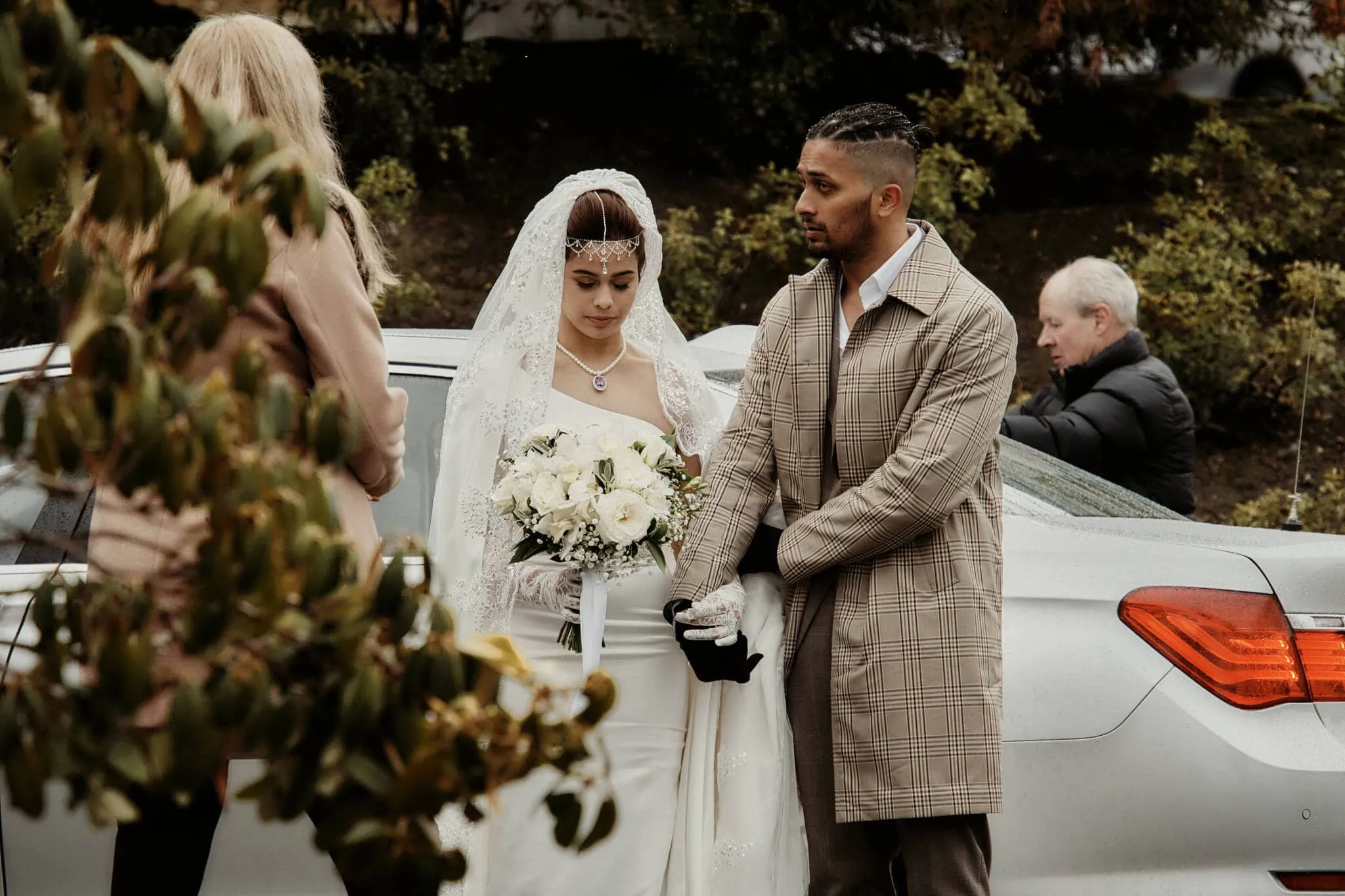 Queenstown New Zealand Elopement Wedding Photographer - Wasim and Yumn in Queenstown, standing next to a car.