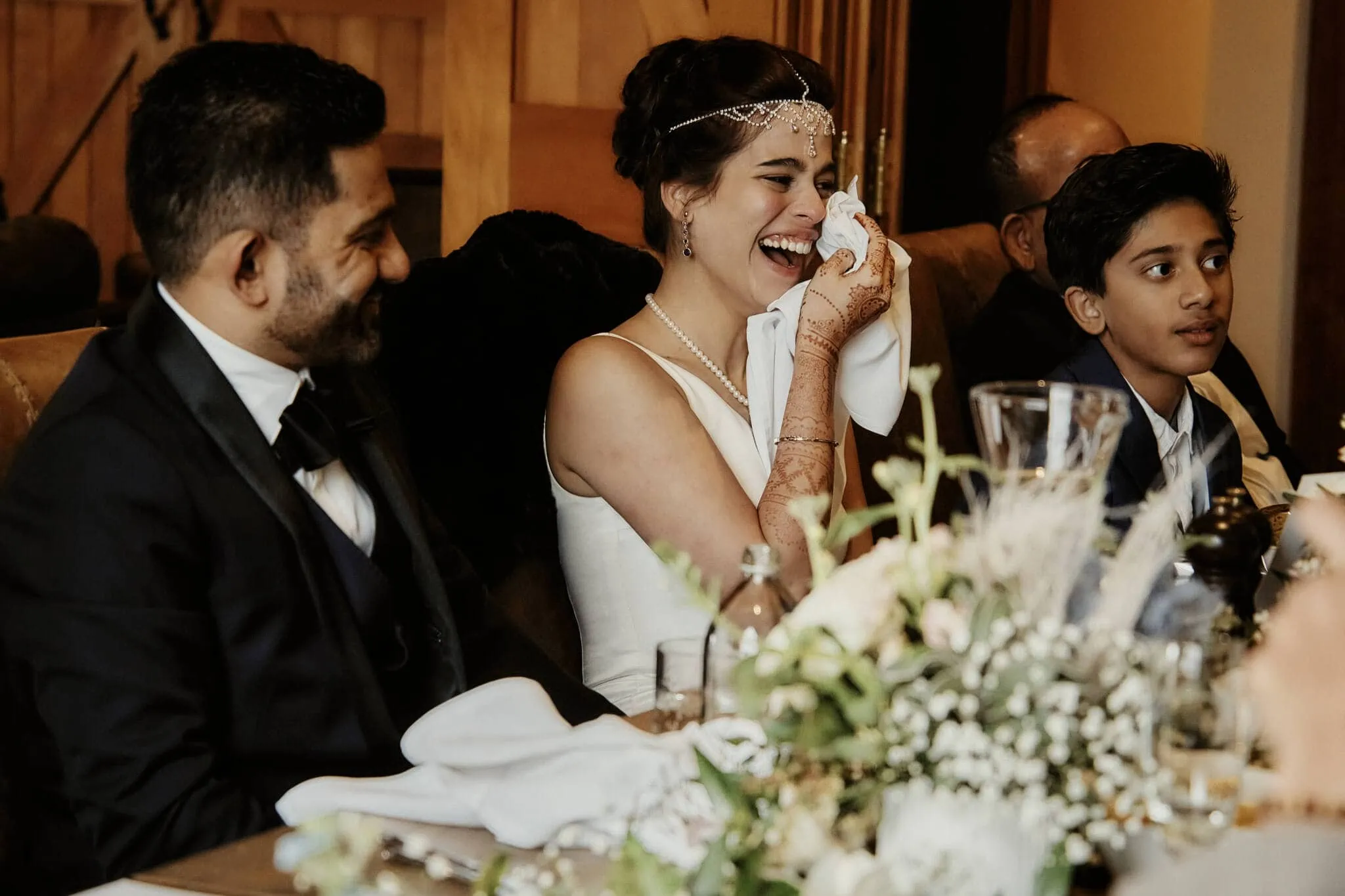 Queenstown New Zealand Elopement Wedding Photographer - Wasim and Yumn laughing at their Queenstown Islamic Wedding reception.