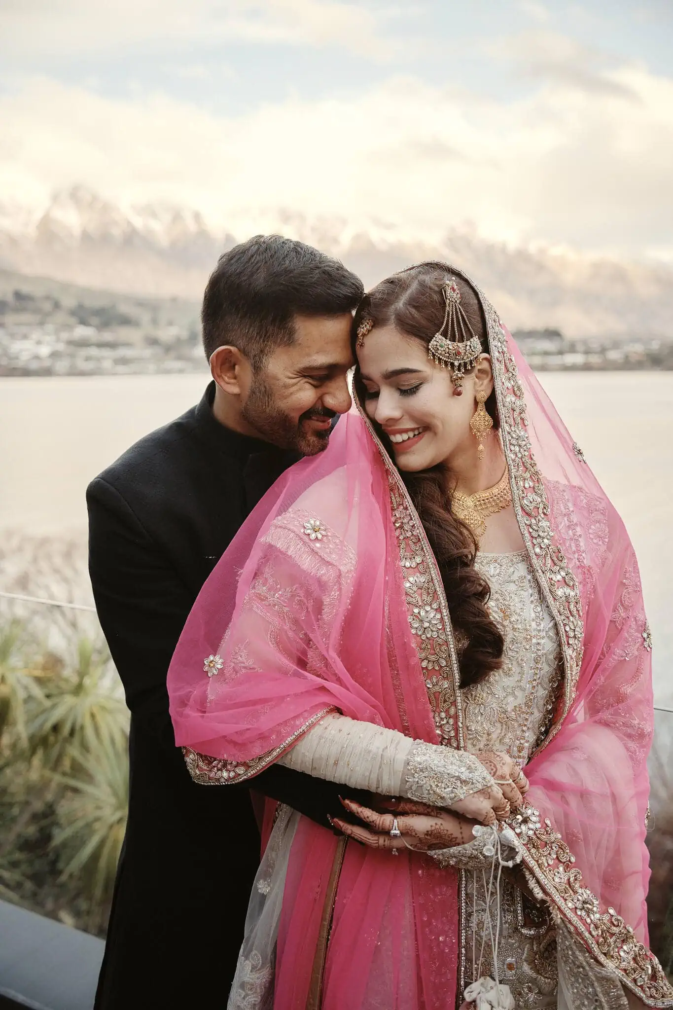 Queenstown New Zealand Elopement Wedding Photographer - A Queenstown Islamic wedding captures Wasim and Yumn's embrace in front of a picturesque lake.