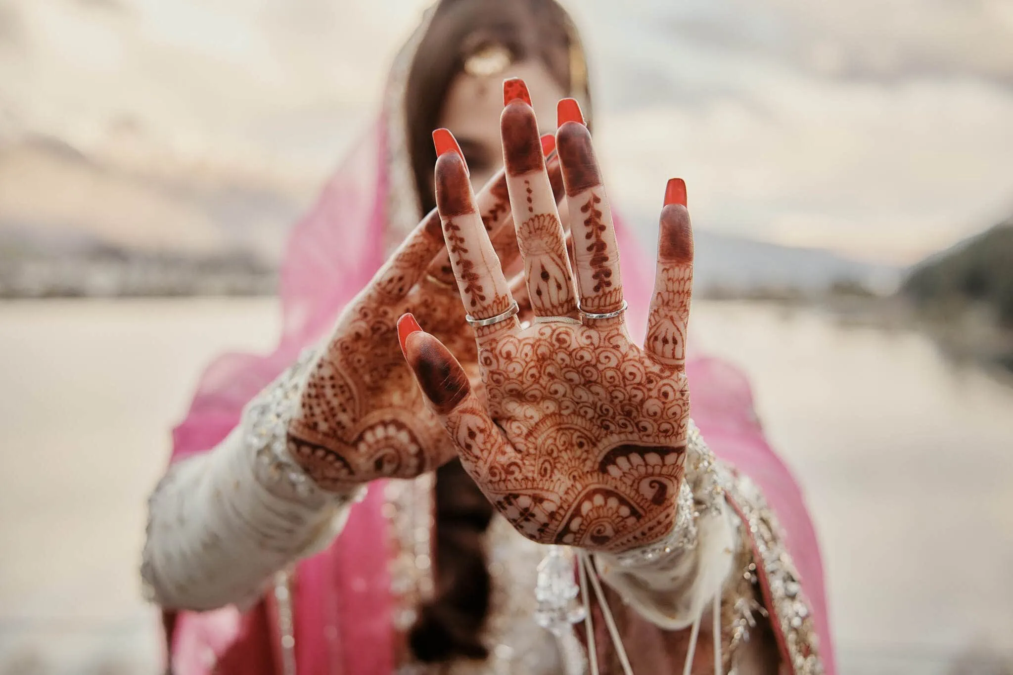 Queenstown New Zealand Elopement Wedding Photographer - A bride with henna on her hands at the Queenstown Islamic Wedding of Wasim and Yumn.