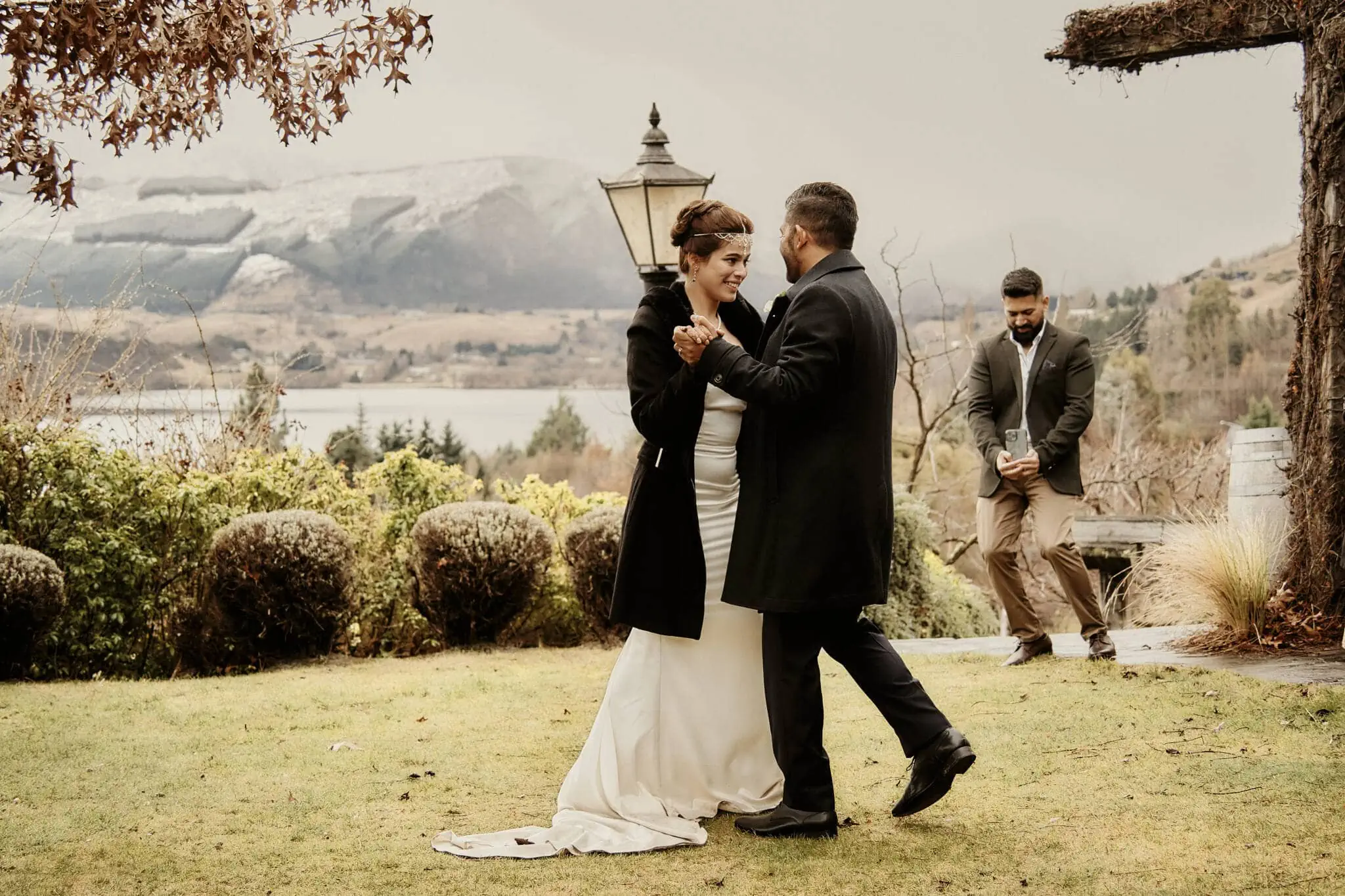 Queenstown New Zealand Elopement Wedding Photographer - The bride and groom, Wasim and Yumn, sharing a kiss during their Queenstown Islamic wedding near a lake.