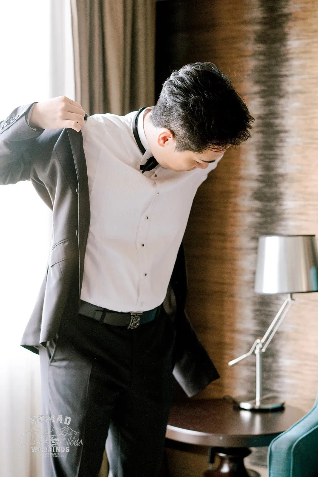 Queenstown New Zealand Elopement Wedding Photographer - Keywords: man, adjusting, suit, hotel room