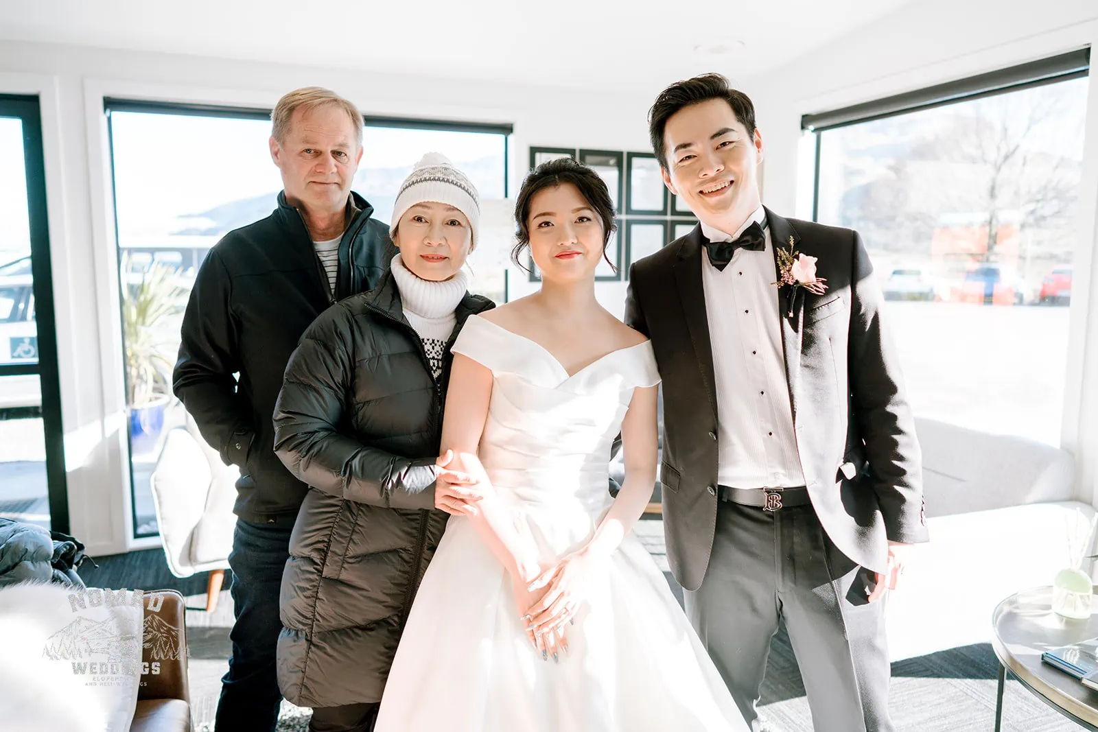 Queenstown New Zealand Elopement Wedding Photographer - A bride and groom, Bo and Junyi, posing for a hotel room photo shoot during their Heli Pre Wedding Shoot with 4 landings.