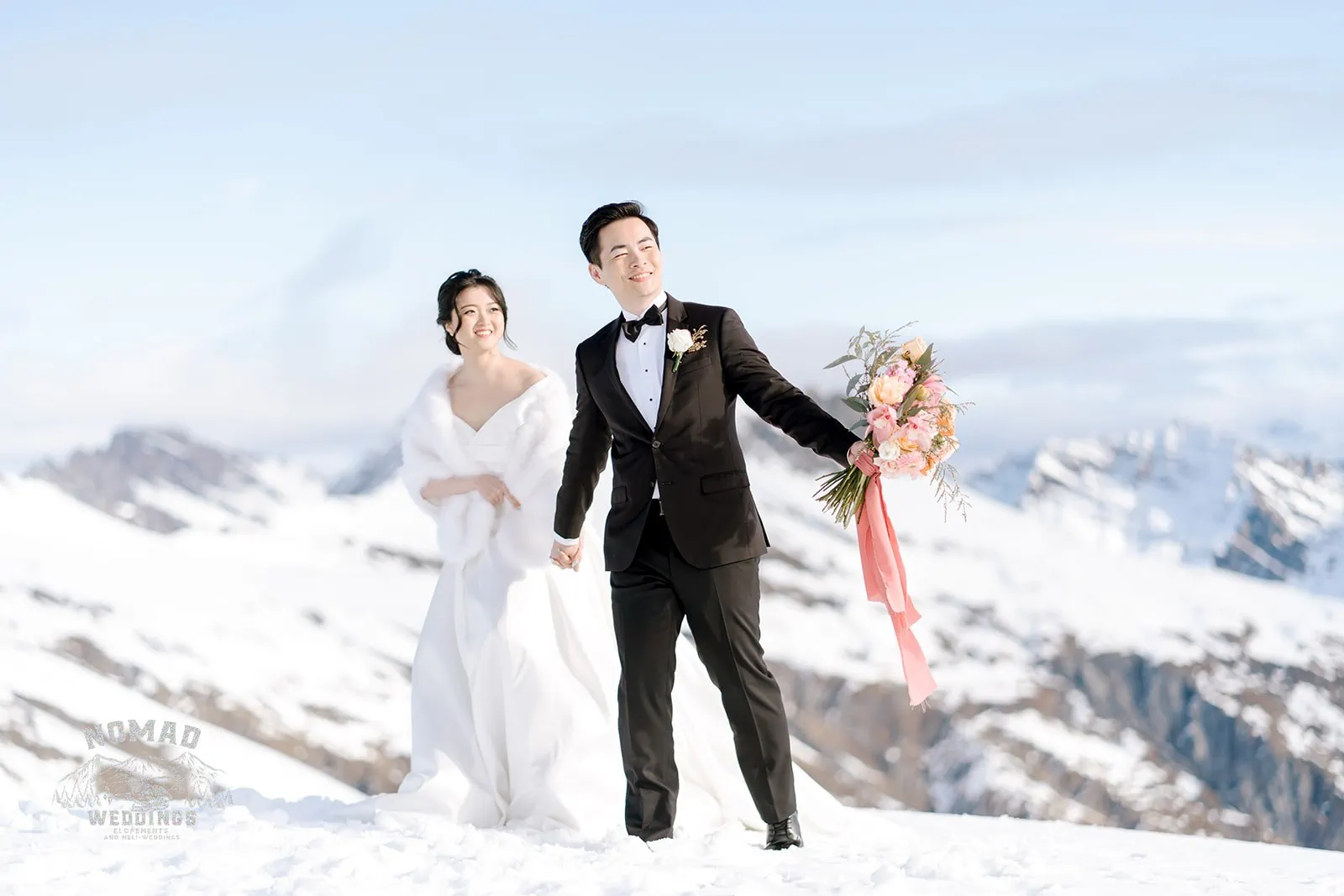 Queenstown New Zealand Elopement Wedding Photographer - A bride and groom named Bo and Junyi having a Heli Pre Wedding Shoot with 4 Landings on top of a snow covered mountain.