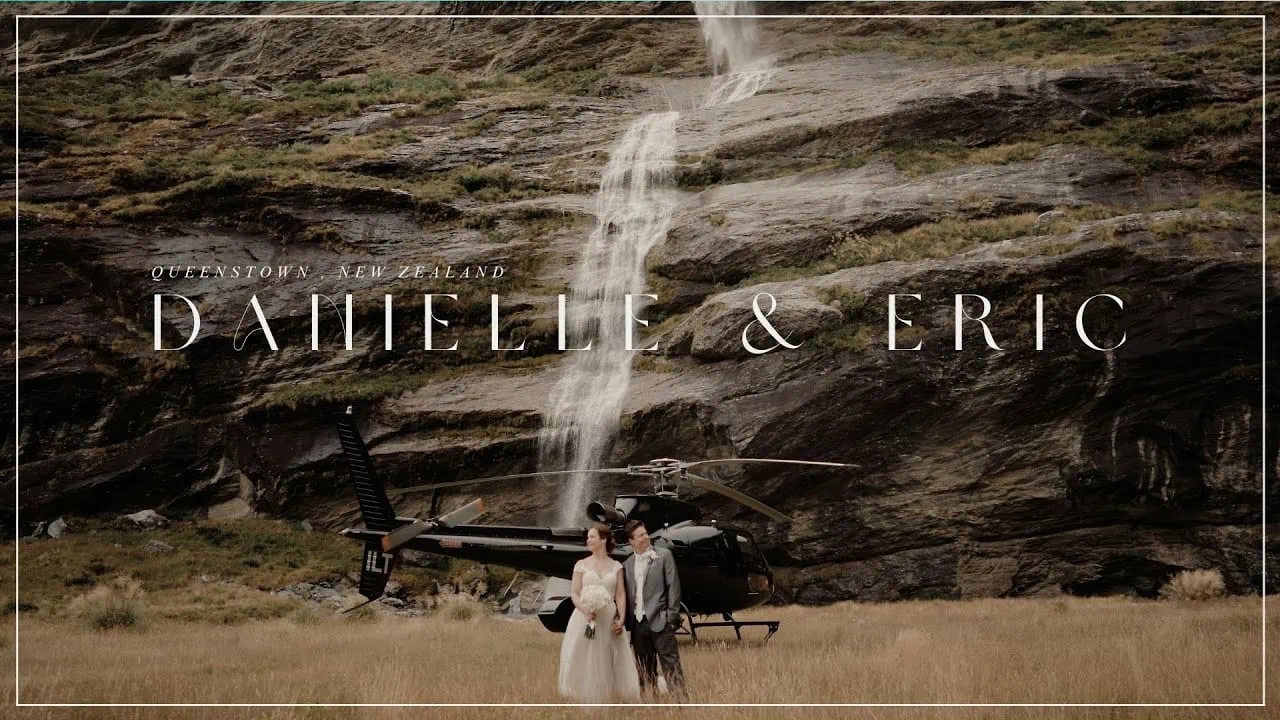Queenstown New Zealand Elopement Wedding Photographer - Danielle u0026 Eric's Queenstown elopement wedding captured in front of a stunning waterfall, with a helicopter in the background.