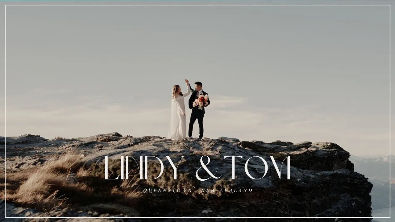 Queenstown New Zealand Elopement Wedding Photographer - A couple standing on top of a mountain in Queenstown, in a Lindy u0026 Tom elopement wedding video.