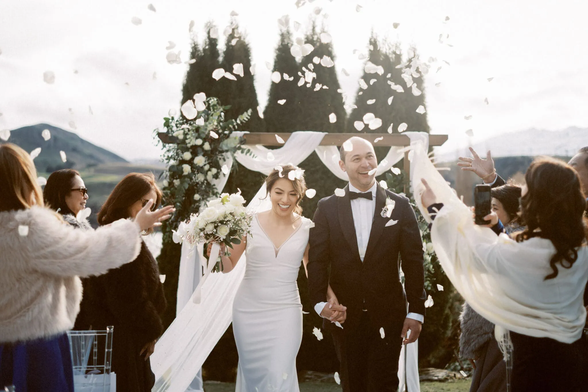 Queenstown New Zealand Elopement Wedding Photographer - Reyn and Justin celebrate their Stoneridge Estate Wedding with a joyous walk down the aisle, surrounded by confetti.