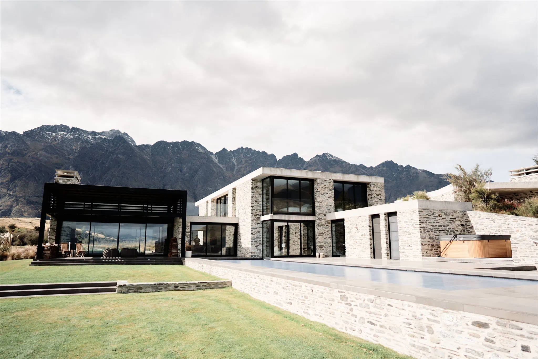 Queenstown New Zealand Elopement Wedding Photographer - A modern house with stunning mountain backdrop.