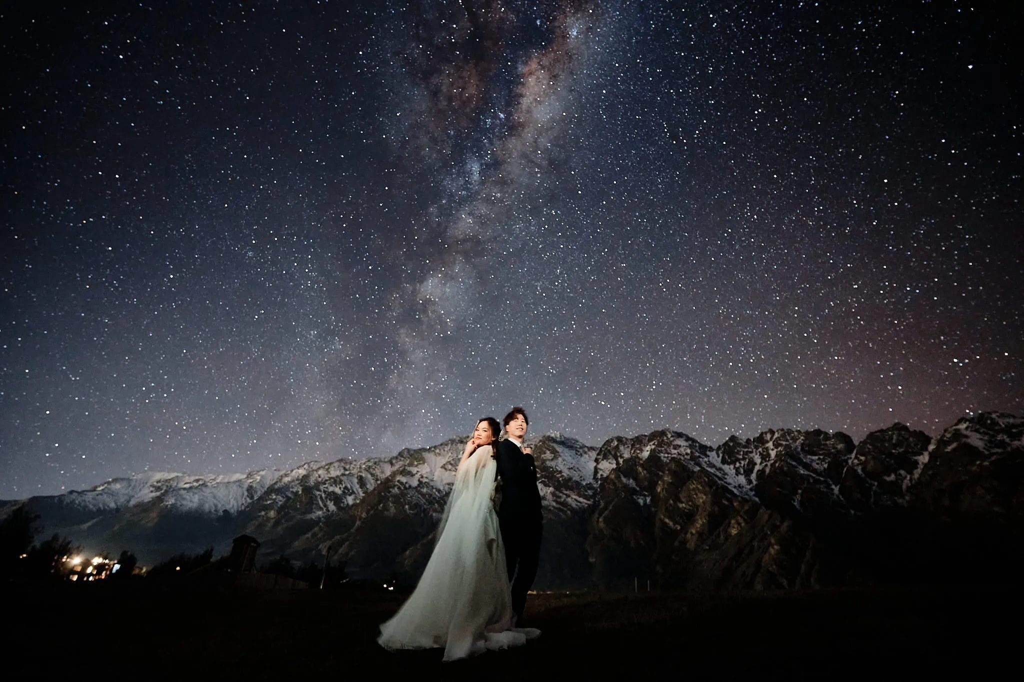 Queenstown New Zealand Elopement Wedding Photographer - A bride and groom captured in a breathtaking starry night shoot for their portfolio.