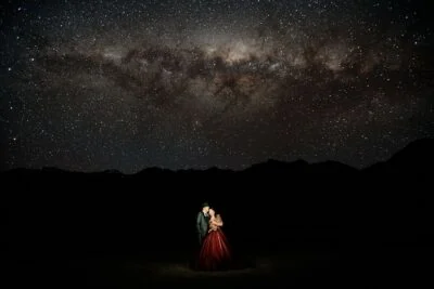Queenstown New Zealand Elopement Wedding Photographer - A bride and groom standing under the starry sky.