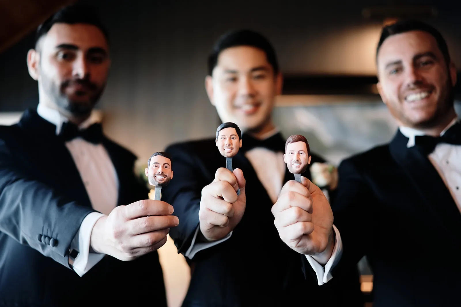 Queenstown New Zealand Elopement Wedding Photographer - A group of groomsmen holding up fake groomsmen heads during a traditional wedding.
