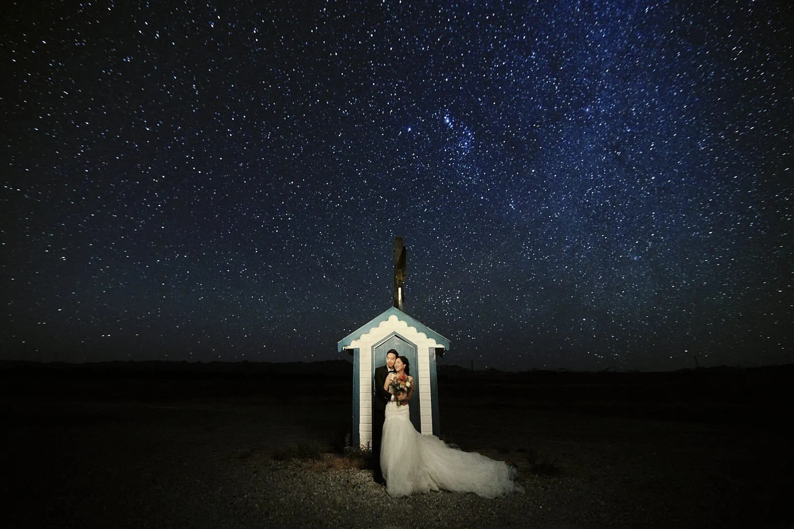 Queenstown New Zealand Elopement Wedding Photographer - A stunning starry night shoot capturing the enchanting moment of a bride and groom under a mesmerizing starry sky, perfect for our portfolio.