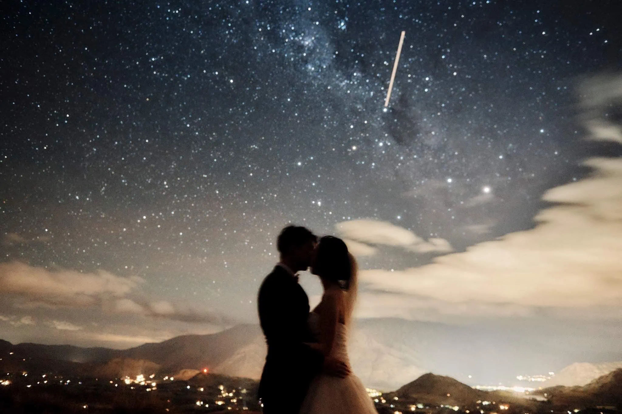 Queenstown New Zealand Elopement Wedding Photographer - A mesmerizing starry night shoot showcasing a passionate moment between a bride and groom.