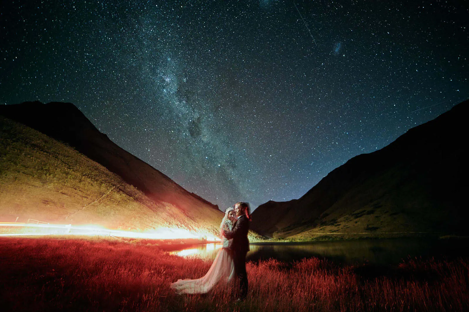 Queenstown New Zealand Elopement Wedding Photographer - A stunning Starry Night shoot capturing the beautiful moment of a bride and groom standing under a starry sky.