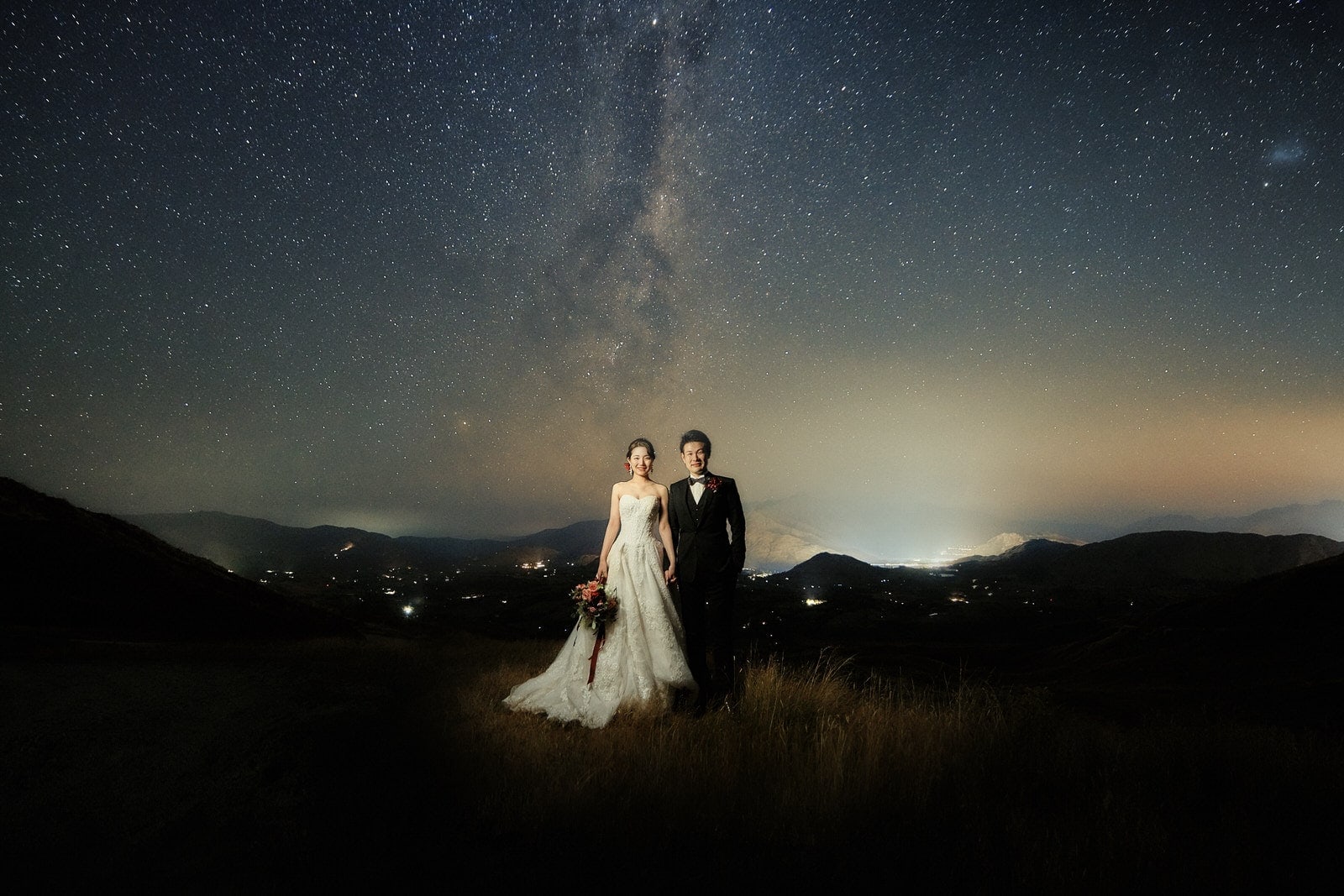 Queenstown New Zealand Elopement Wedding Photographer - A starry night shoot capturing a bride and groom under the mesmerizing Milky Way, adding a stunning addition to our portfolio.