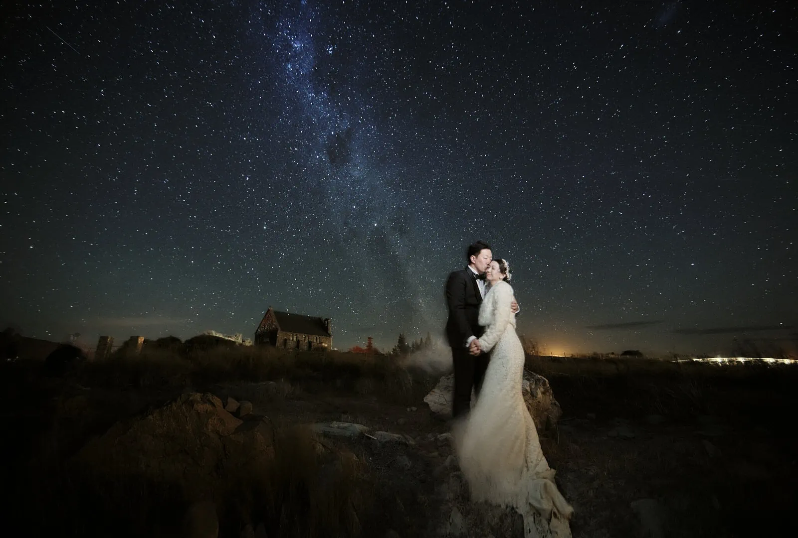 Queenstown New Zealand Elopement Wedding Photographer - A mesmerizing Starry Night Shoot featuring a bride and groom standing under the milky way, beautifully captured for our portfolio.