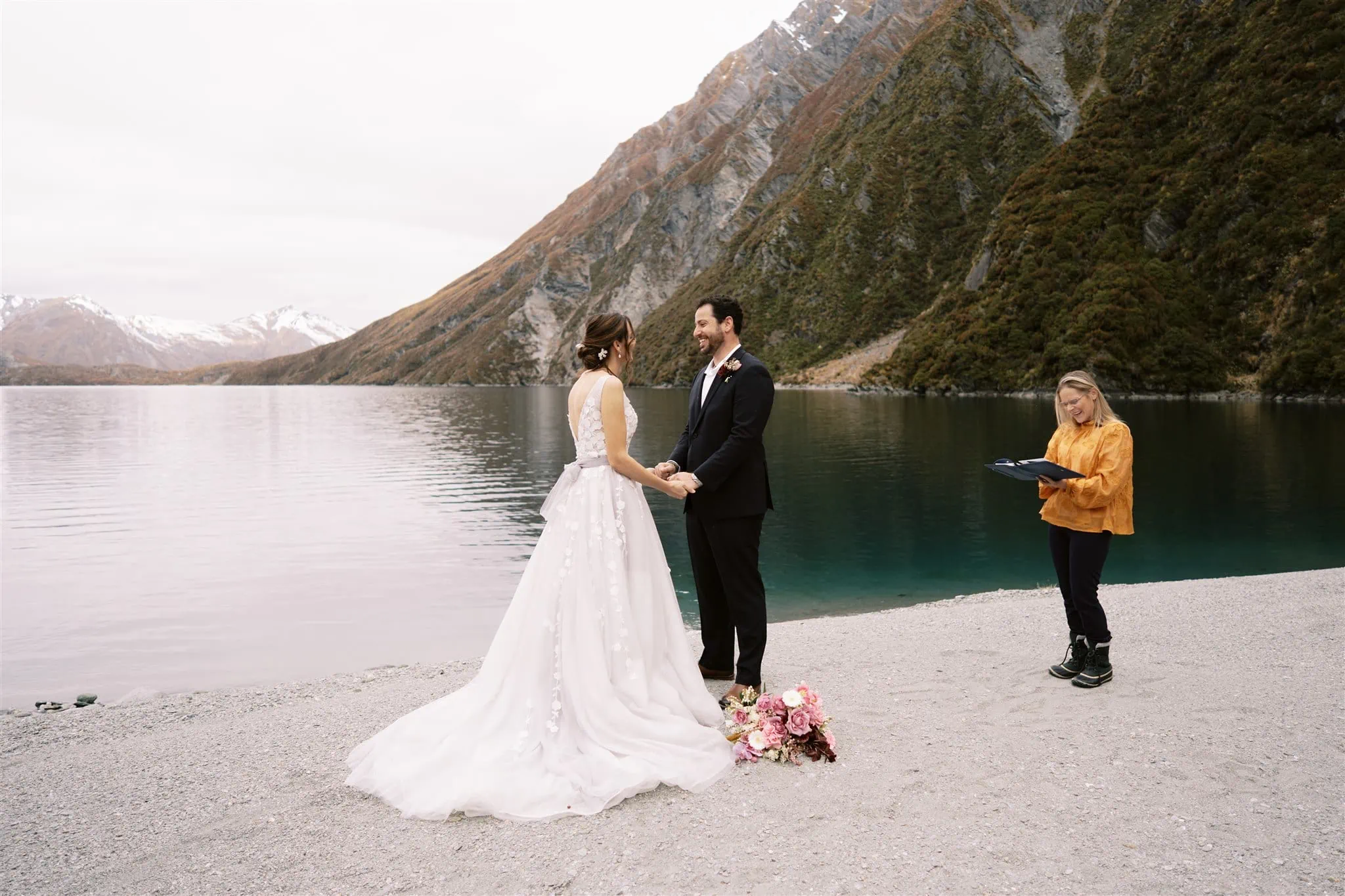 Queenstown New Zealand Elopement Wedding Photographer - Alex & Shahar, a bride and groom enjoying a Stargazing Date on the shore of a lake in Queenstown, New Zealand.