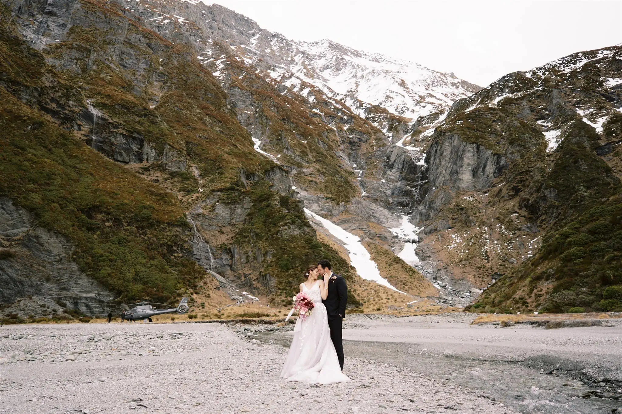 Queenstown New Zealand Elopement Wedding Photographer - Shahar and Alex, a bride and groom, enjoy a romantic Stargazing Date by the river in New Zealand.