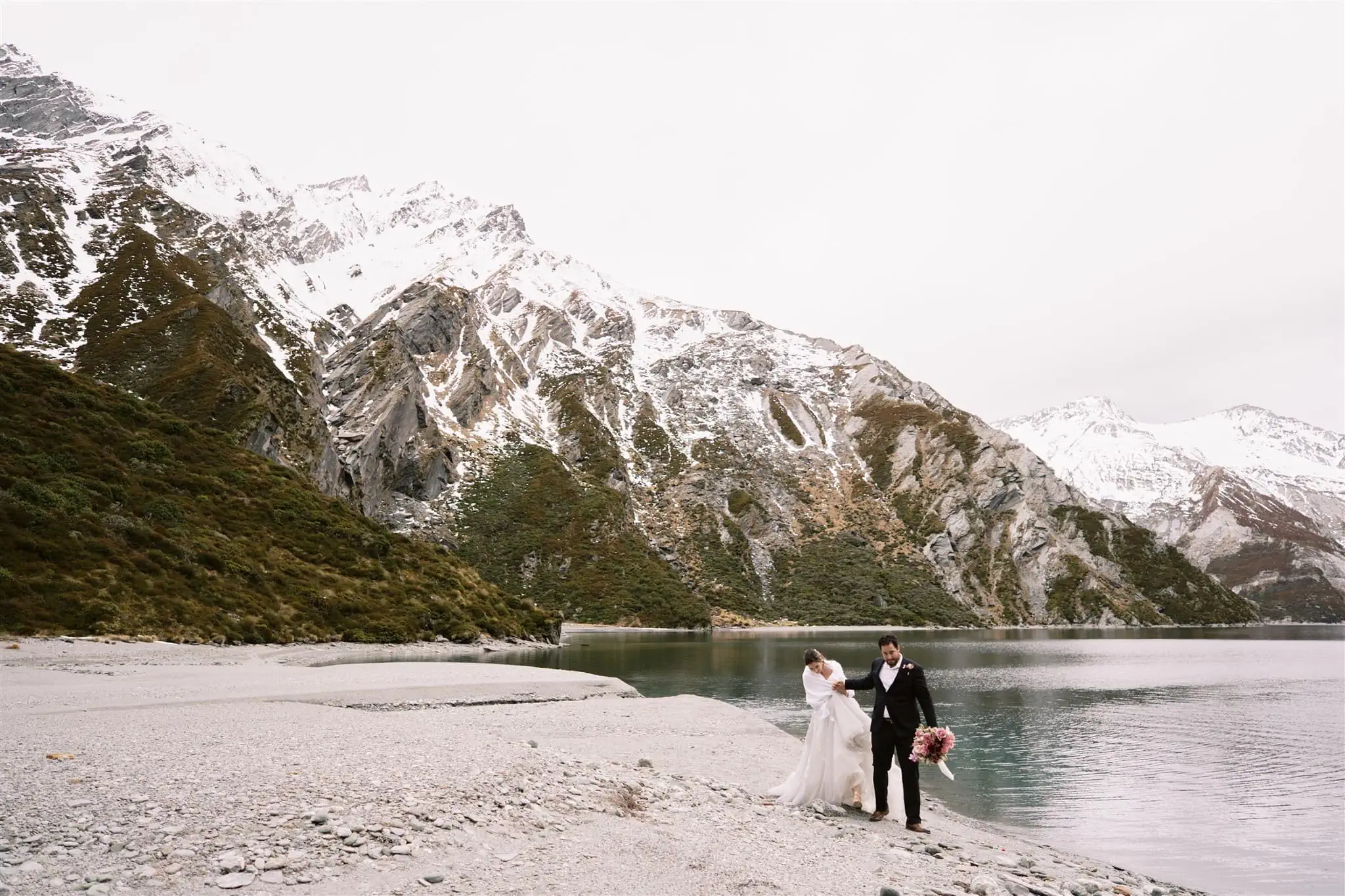 Queenstown New Zealand Elopement Wedding Photographer - Alex & Shahar, a bride and groom, enjoying a Stargazing Date on the shore of a lake in Queenstown, New Zealand for their romantic Queenstown Elopement.