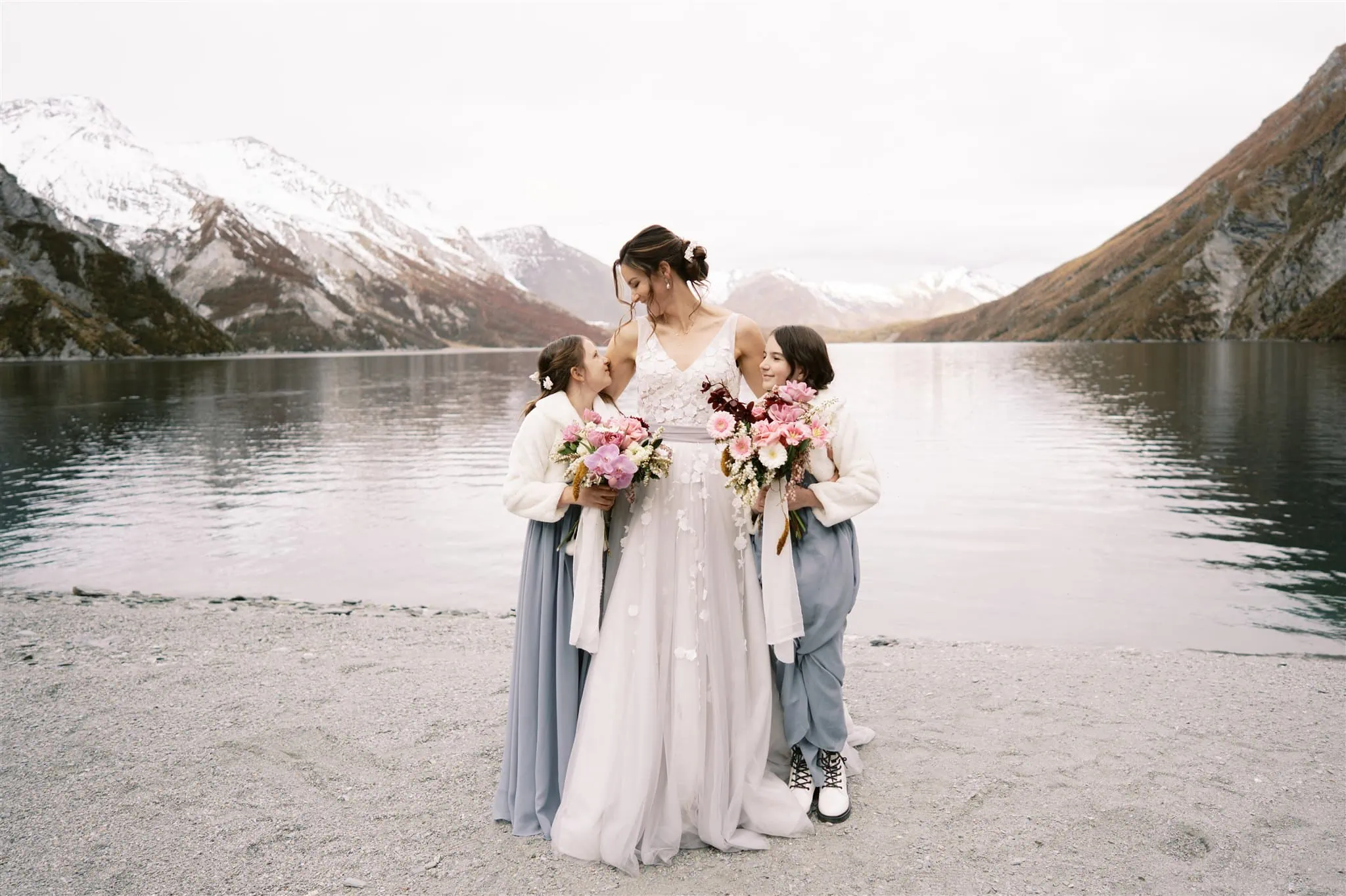 Queenstown New Zealand Elopement Wedding Photographer - Alex & Shahar, an adventurous couple from Queenstown, chose a breathtaking location for their elopement. With the serene lake shimmering in the foreground and majestic mountains towering in the background
